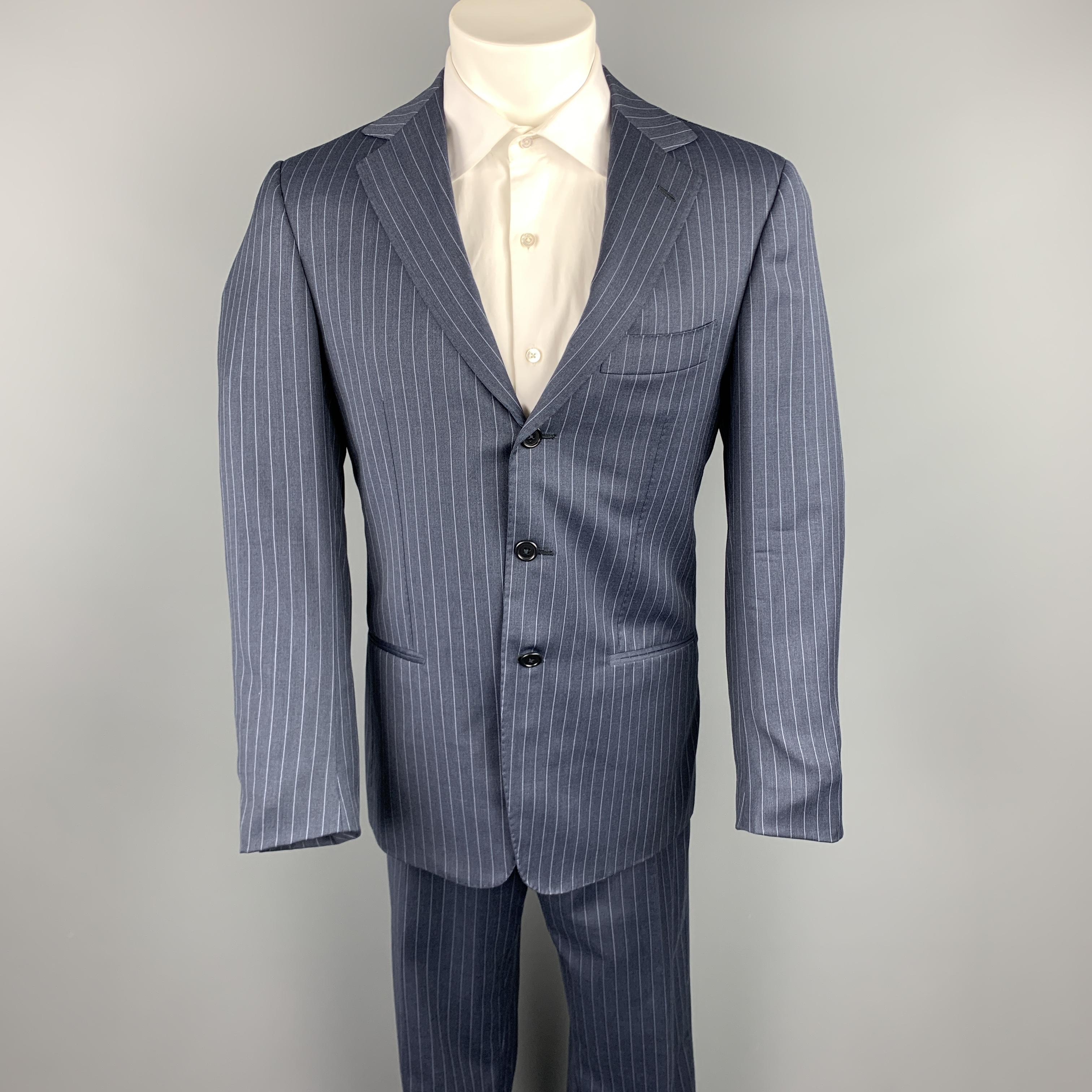 BORRELLI suit comes in a navy stripe wool and includes a single breasted, three button sport coat with notch lapel and matching flat front trousers. Made in Italy.

Excellent Pre-Owned Condition.
Marked: IT 48

Measurements:

-Jacket
Shoulder: 15.5