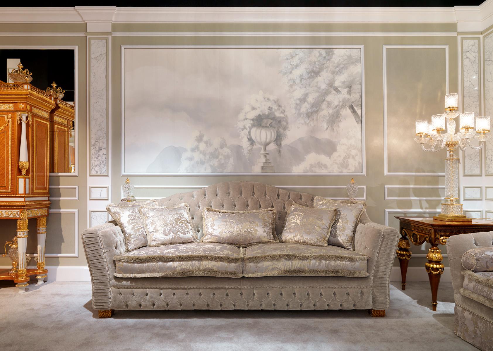 The Borromeo three-seat sofa, which has become one of the iconic models distinguishing the Zanaboni brand, is presented here in the grey version, fully upholstered in velvet with handcrafted button tufting and fabric pleating techniques, enhanced