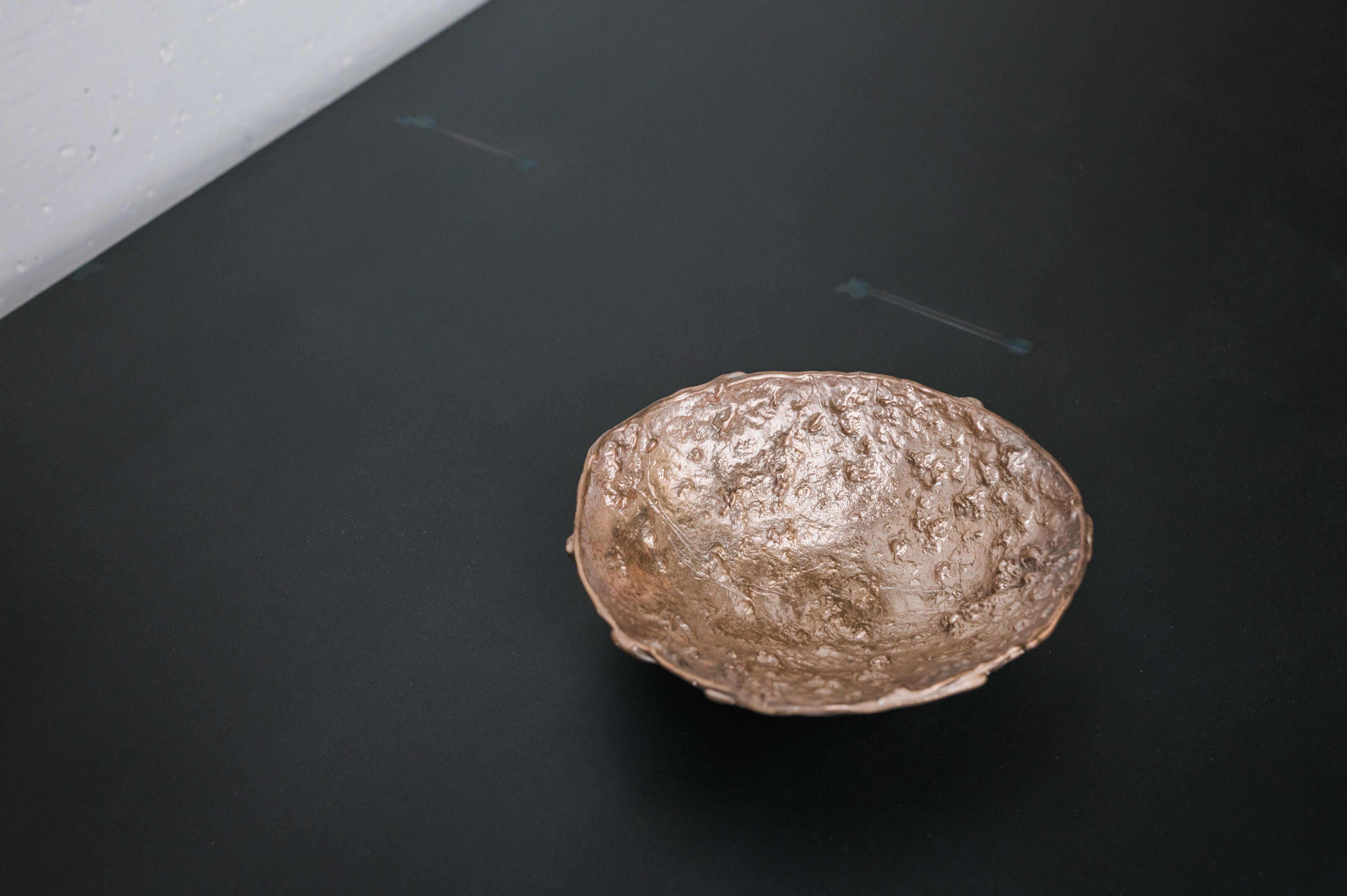 Borrowed Forms takes on loan shapes of the natural world and translates them into domestic objects. Rocks, charred wood, and forest debris from the Pacific Northwest are selected for form and texture, and their impressions are captured in poured