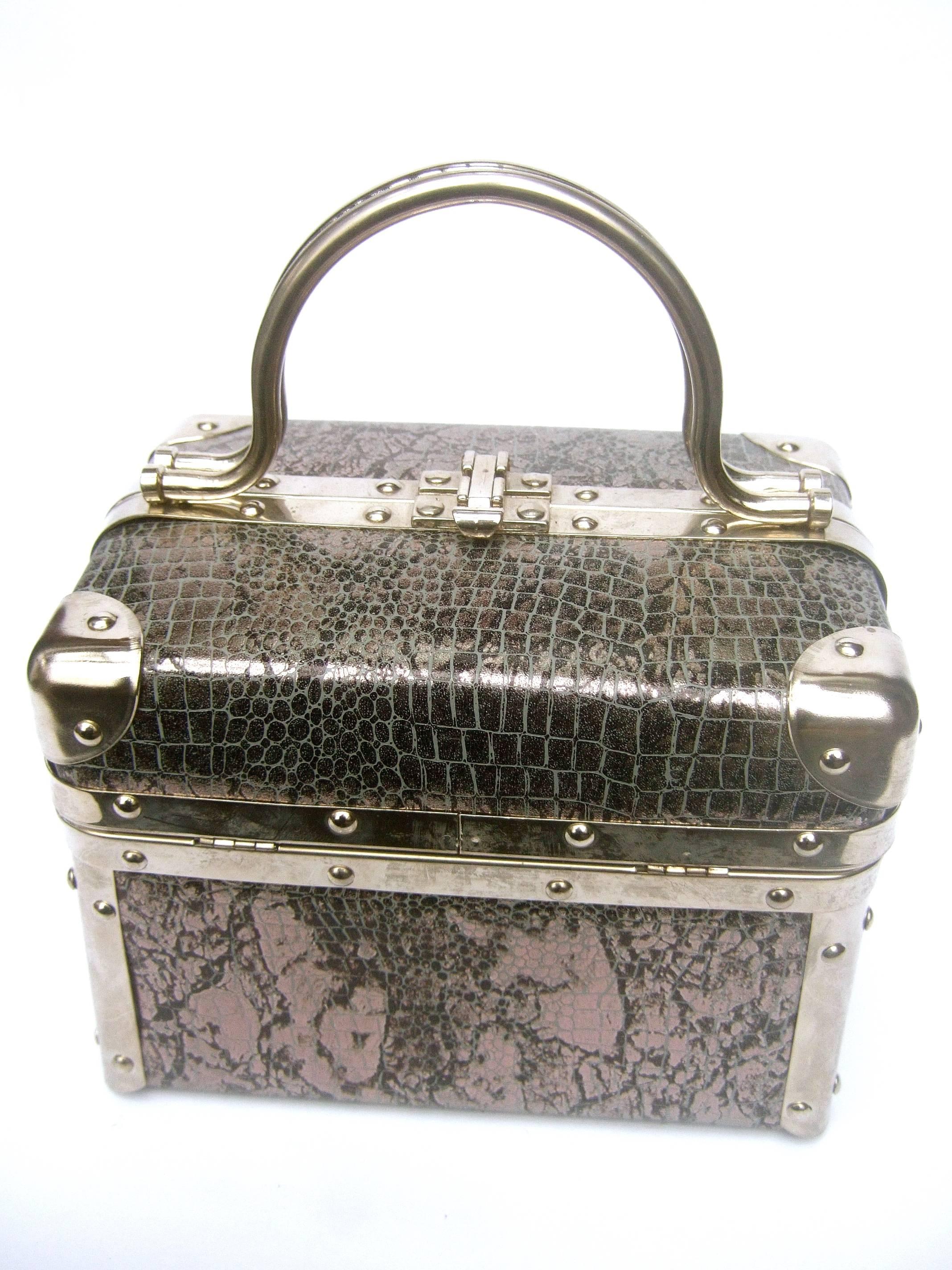 Borsa Bella Italian metallic embossed vinyl box purse c 1980s
The stylish Italian handbag is covered with a silver - gray
embossed vinyl covering that emulates reptile skin 

Designed with sleek chrome metal swivel handles
Accented with chrome metal