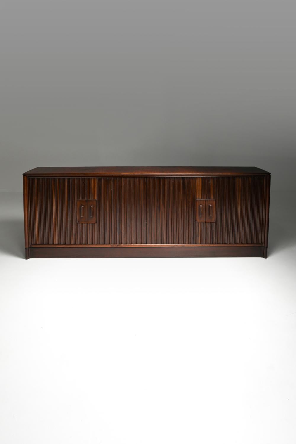 Osvaldo Borsani and Lucio Fontana credenza, Italy, circa 1950

Quite a Minimalist item for its midcentury era.
Luxury and high quality storage piece by one of Italy's greatest.
Beautiful variations in color of the wood grain.

We've presented