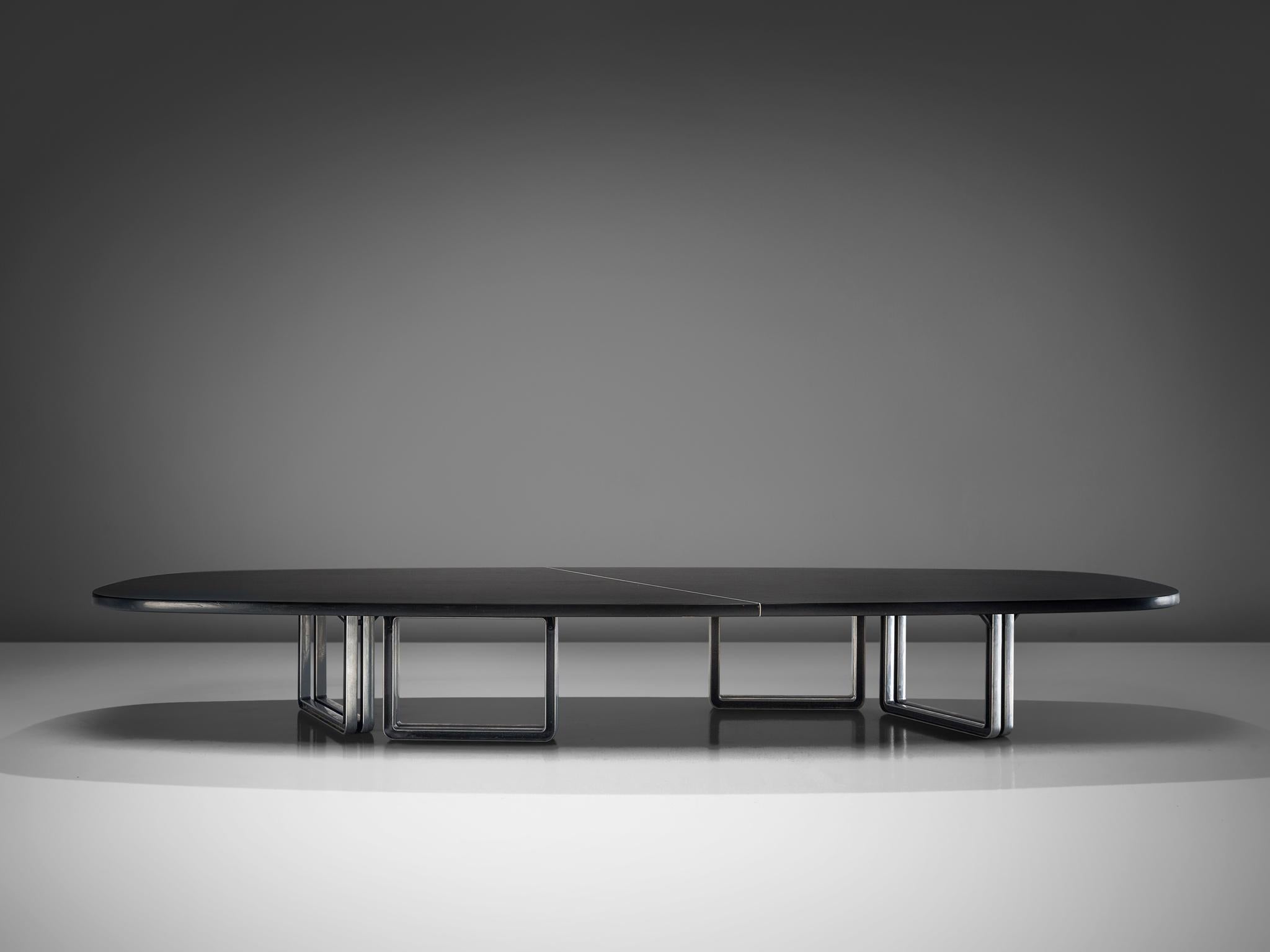 Borsani for Tecno, lacquered black wood and aluminum base, conference table 335a, Italy, 1975-1978.

Large oversized conference table with a black top designed by Osvaldo Borsani. The table is composed of two black pieces connected via steel inserts