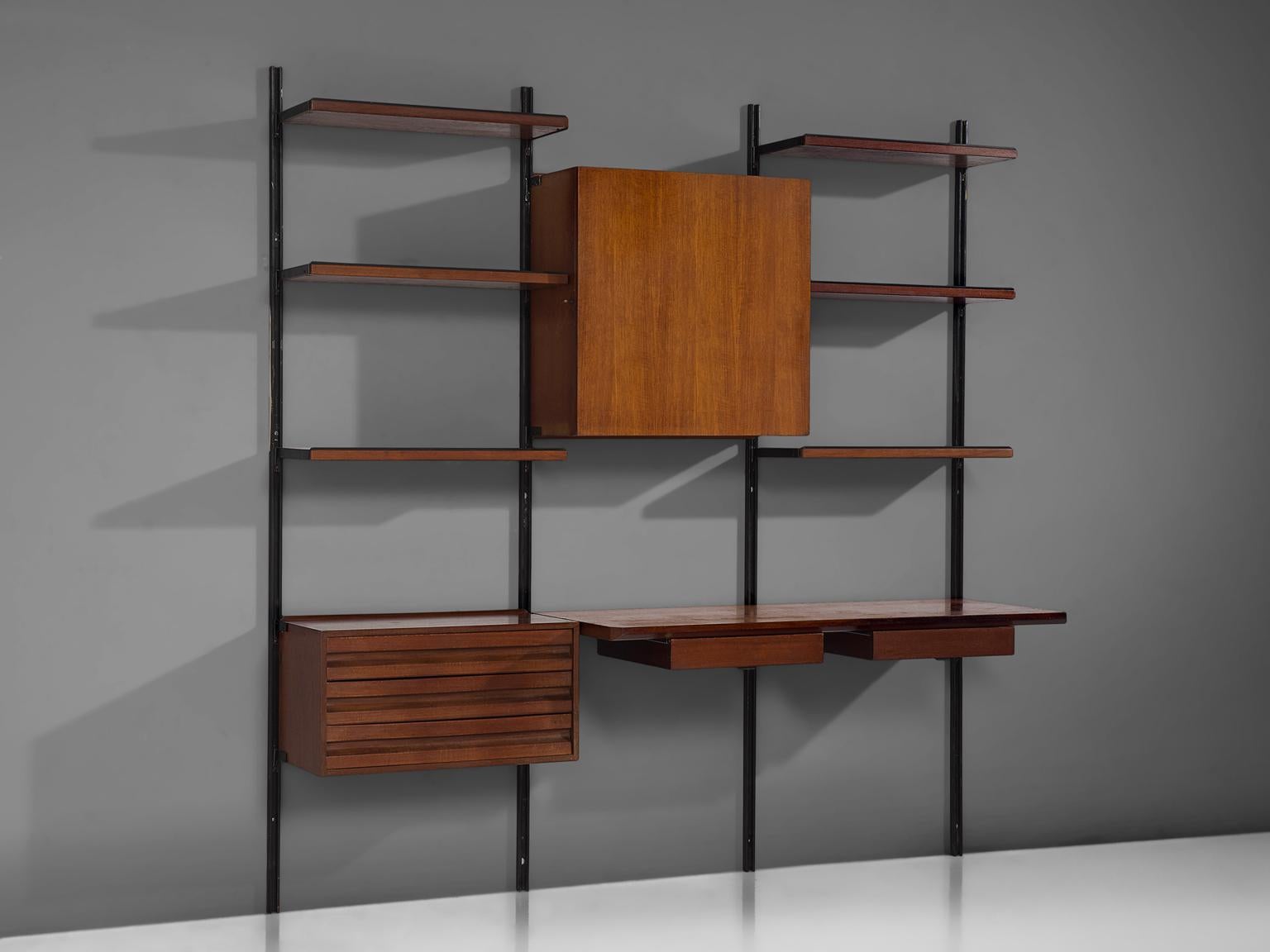 Osvaldo Borsani for Tecno, wall unit with desk, metal and teak, Italy, 1950s.

This wall-mounted shelving unit of three sections can be used as a bookcase and a desk as well. The system was developed by Borsani as coordinated system for furnishing