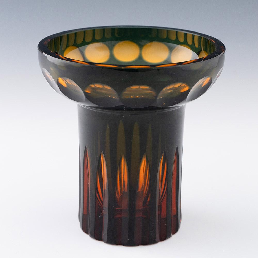 Heading : Borske Sklo cased and cut glass vase
Date : c1970
Origin : Czechoslovakia
Bowl Features : Lightly tapered stem with with everted rim. Slice cut stem with lens cutting to the rim
Type : Lead
Size :
Condition : Excellent, no chips or