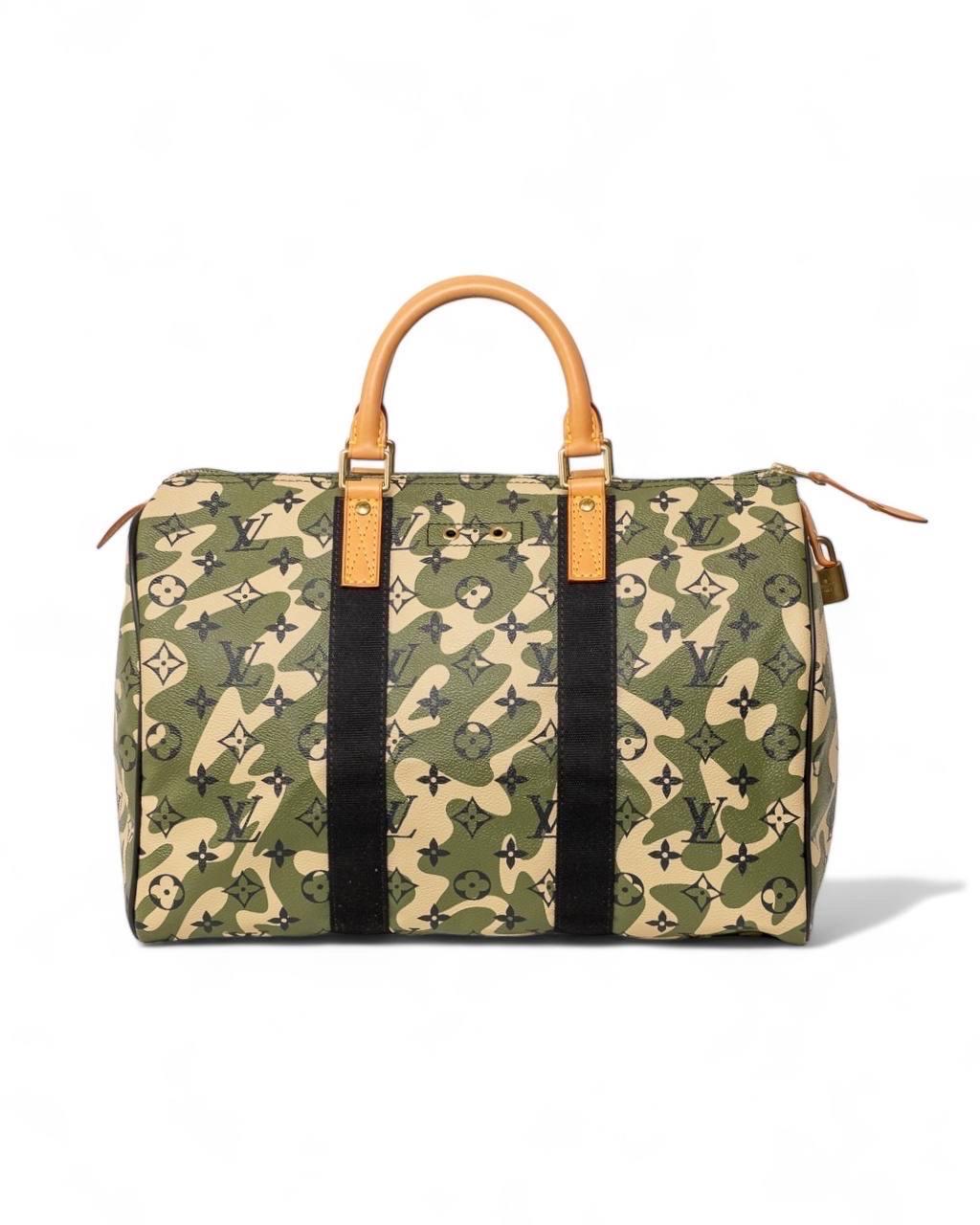 Travel bag designed by Louis Vuitton, Speedy model, size 35, limited edition in collaboration with Takashi Murakami, Monogramouflage line. Made of military patterned and monogram canvas, with black canvas and cowhide inserts. Equipped with a top zip