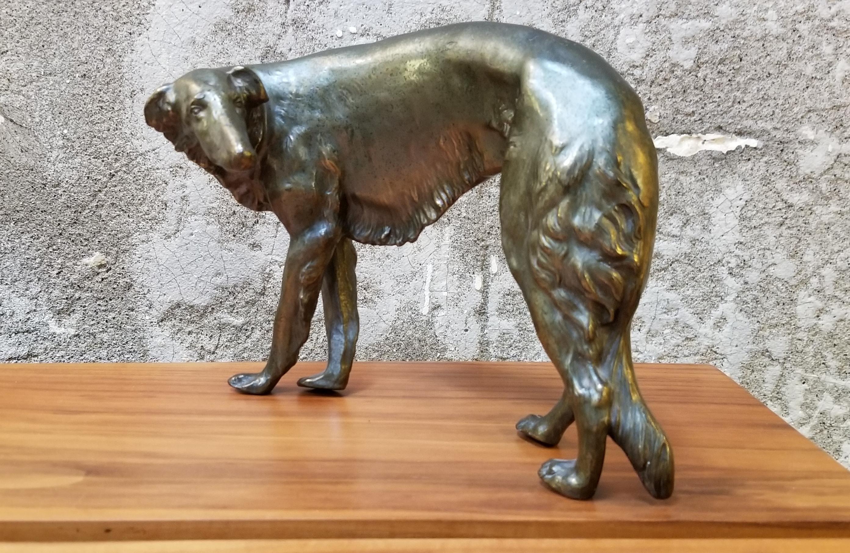 A 1920s bronze patinated, cast spelter figure of a Borzoi by Jennings Brothers. Early 20th century maker of detailed cast figures of dogs and various animals, desk accessories and various decorative objects. Signed JB. Excellent, original condition.