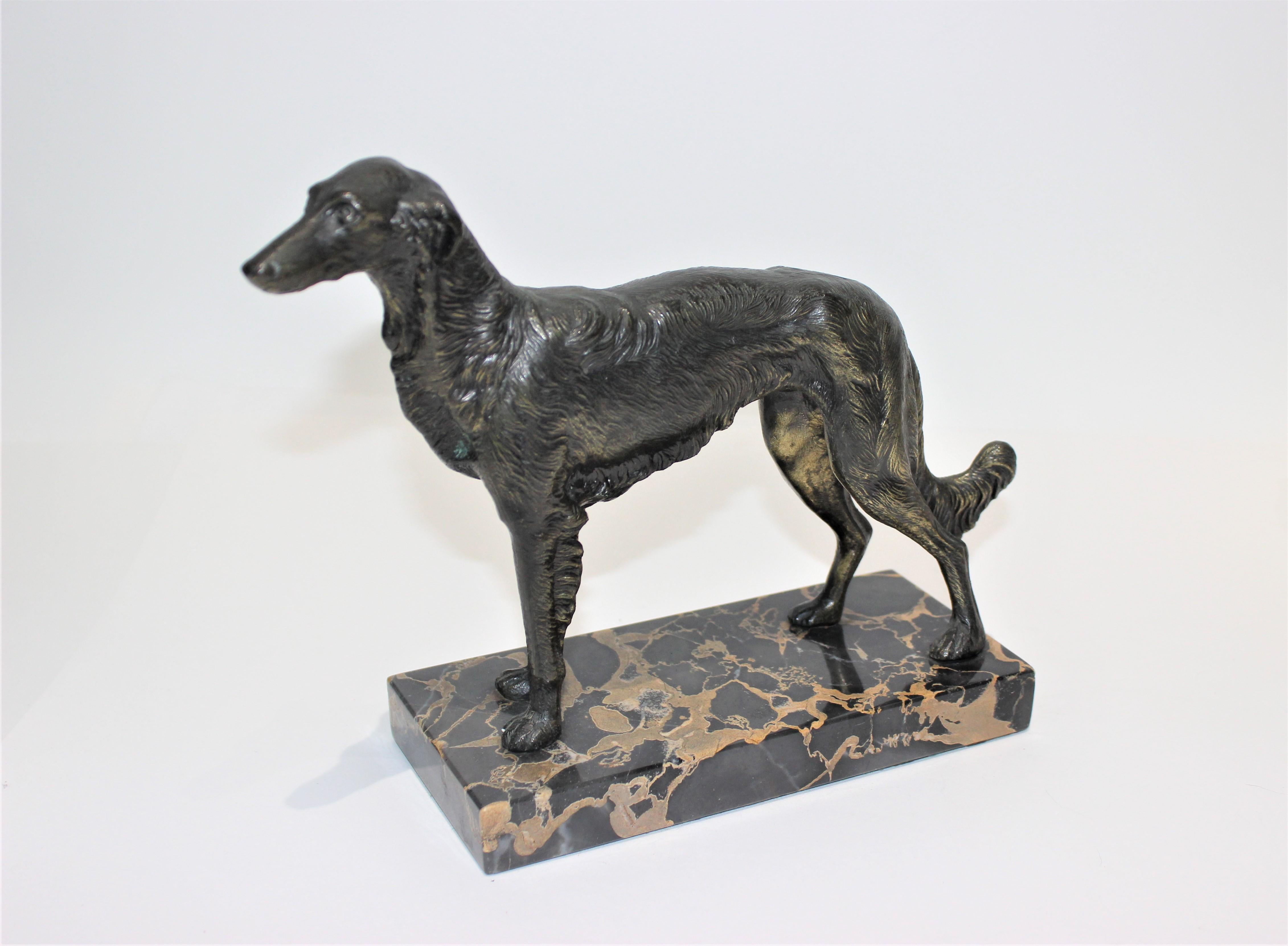 Borzoi 1920s sculpture bronze patina on marble Russian Wolfhound from a Palm Beach estate. 

Iconic early Art Deco motif 1920s elegant waist high dog, a favorite of glam Hollywood fashionistas and Europe's celebrities

Overall size is 9.75 W x