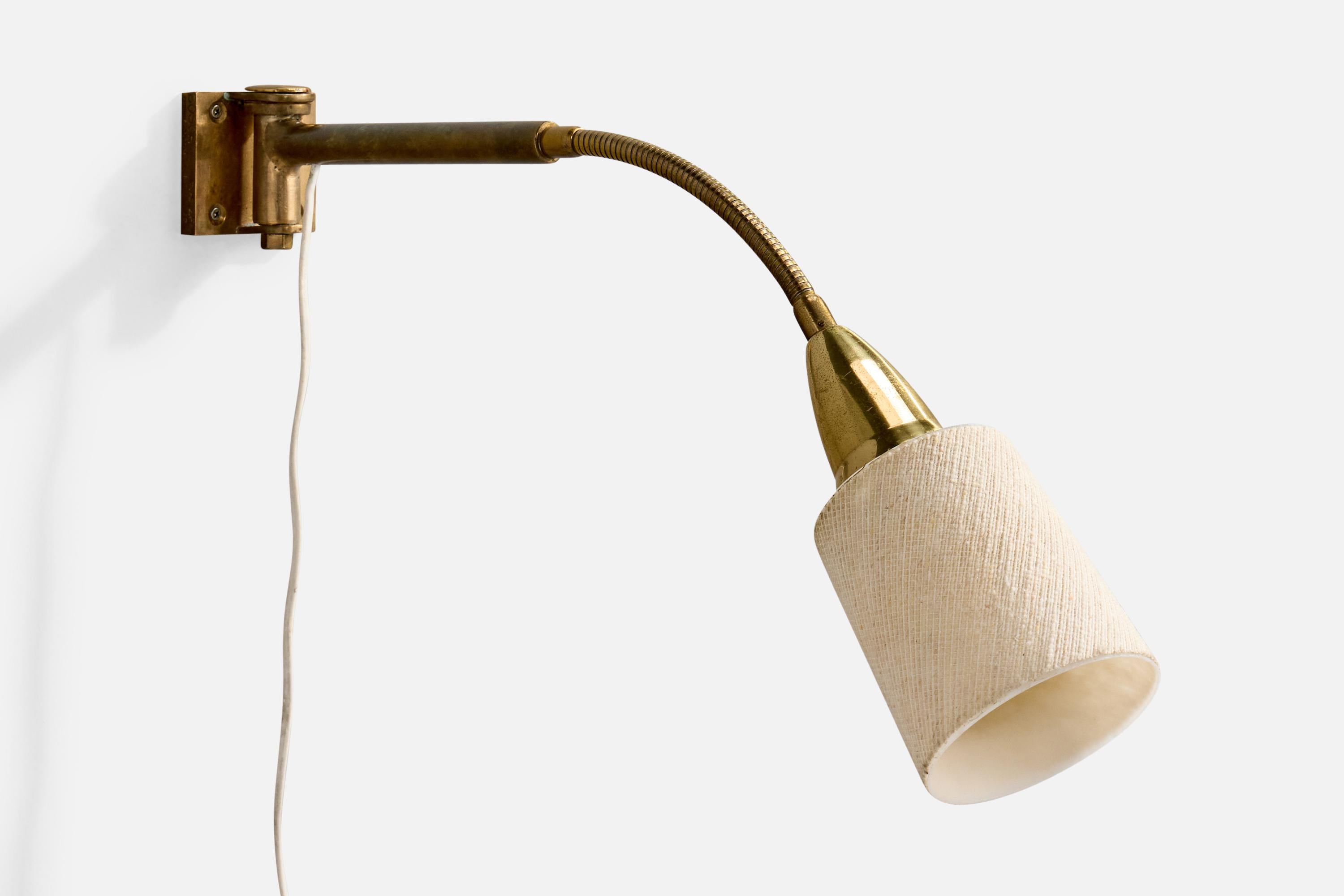A brass and white fabric wall light or industrial task light produced by Bosch, Stuttgart, Germany, c. 1920s.

Overall Dimensions (inches): 11.75