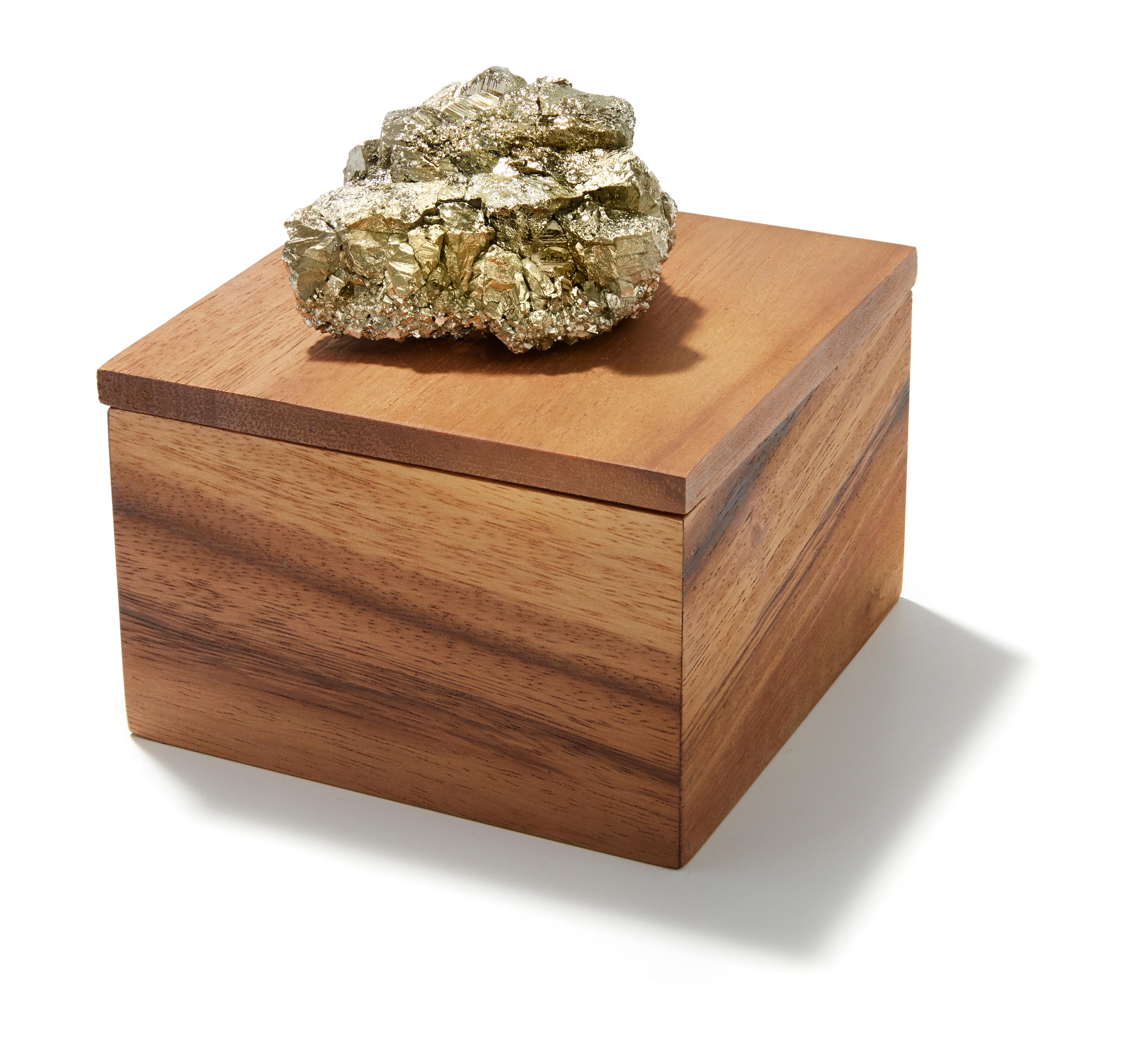 Pairing solid acacia wood with brass and natural stones like amethyst and crystal, these boxes (named after the Portuguese word for wood) are authentic and substantial. Like many of the signature designs from Anna, the natural edges of the stone