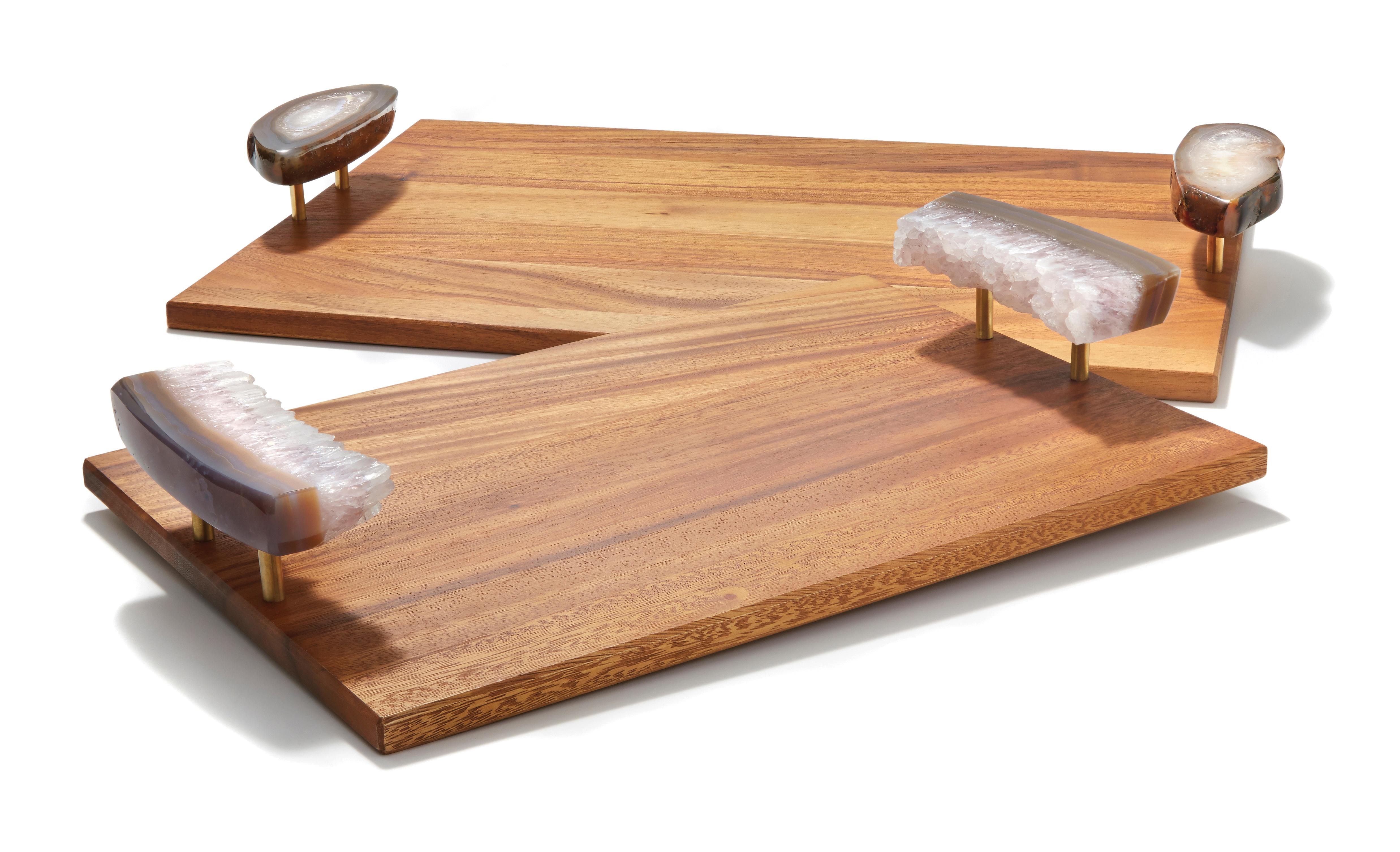 Pairing solid acacia wood with brass and natural stone (rare druze and polished agate), these trays (named after the Portuguese word for wood) are authentic and substantial. Like many of the signature designs from Anna, the natural edges of the