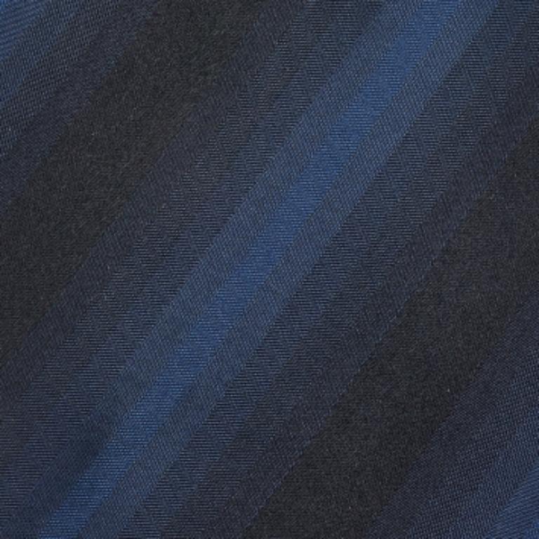 Enhance your formal outfit with this stunning tie from Boss By Hugo Boss. It is tailored using blue-black striped silk fabric and features a width of 9 cm. Complete your style with sophistication as you wear this tie.
