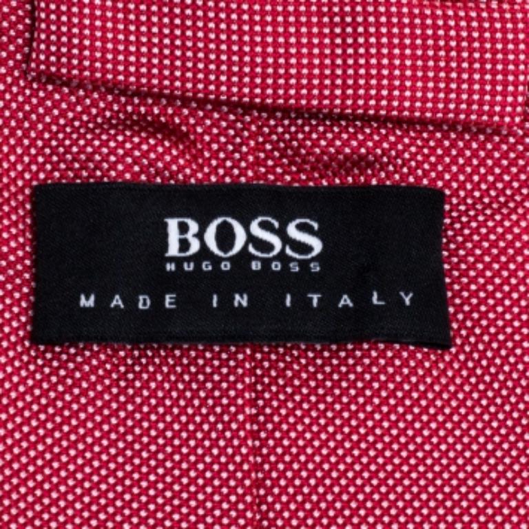 This fabulous tie from Boss by Hugo Boss is perfect to add to your collection! The red tie is made of 100% silk and features a micro dot pattern all over. It comes with a penny keeper strap and the brand label neatly stitched at the back. It is sure