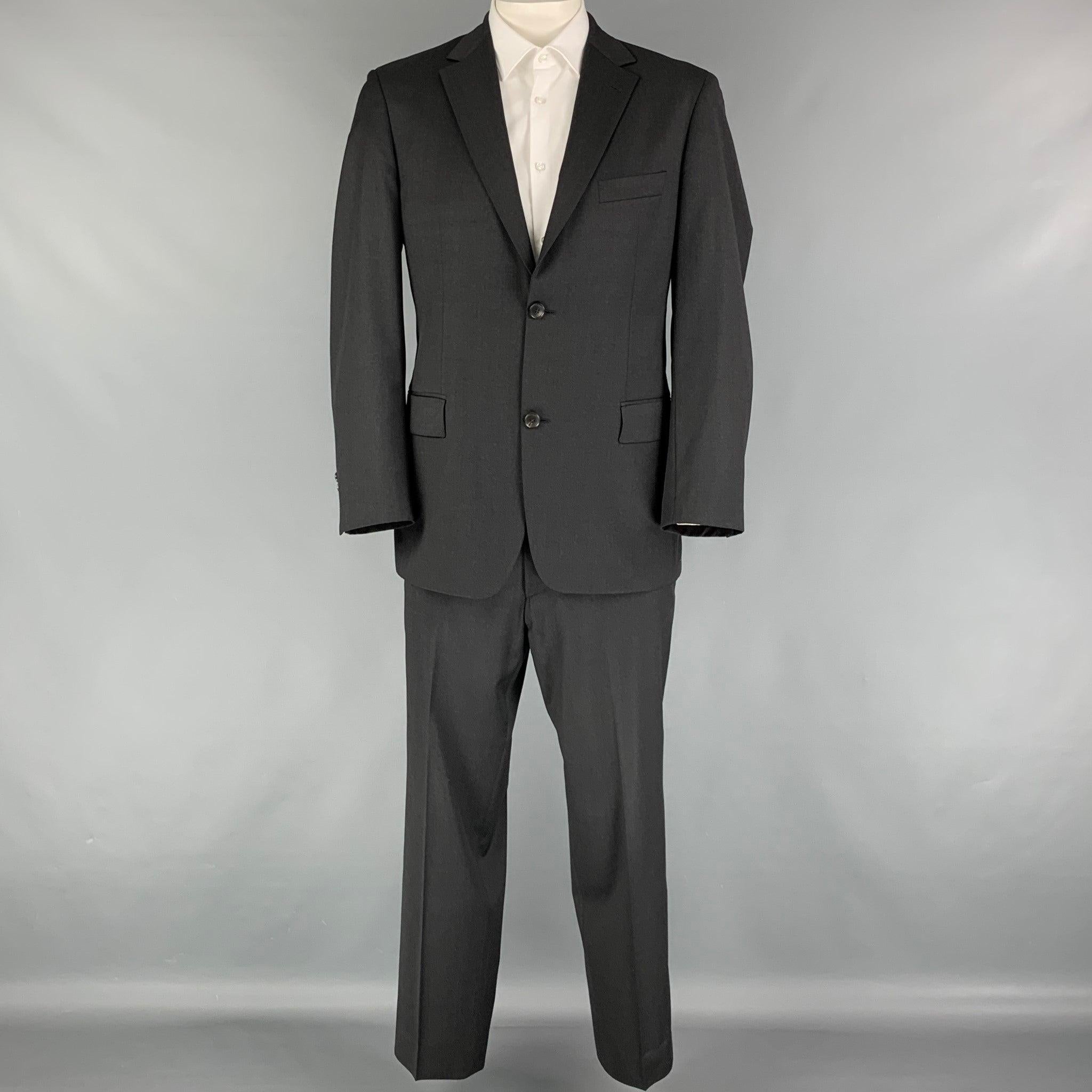BOSS by HUGO BOSS
suit comes in a charcoal virgin wool with a full liner and includes a single breasted, double button sport coat with a notch lapel and matching flat front trousers. Very Good Pre-Owned Condition. 

Marked:   40 

Measurements: 
 
