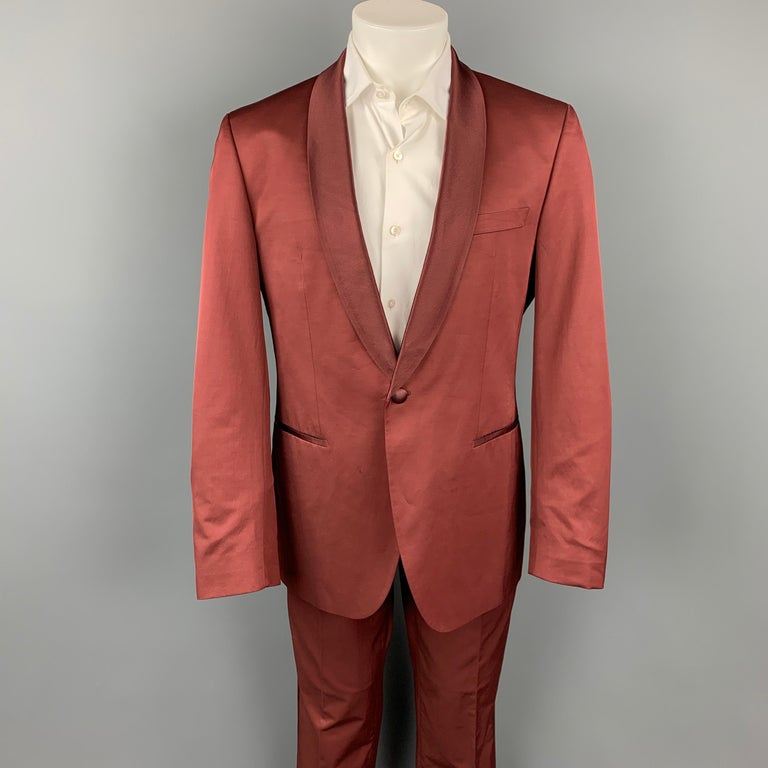 BOSS by HUGO BOSS suit comes in a brick cotton with a full liner and includes a single breasted, single button sport coat with a shawl collar and matching flat front trousers.

Good Pre-Owned Condition.
Marked: 50

Measurements:

-Jacket
Shoulder: