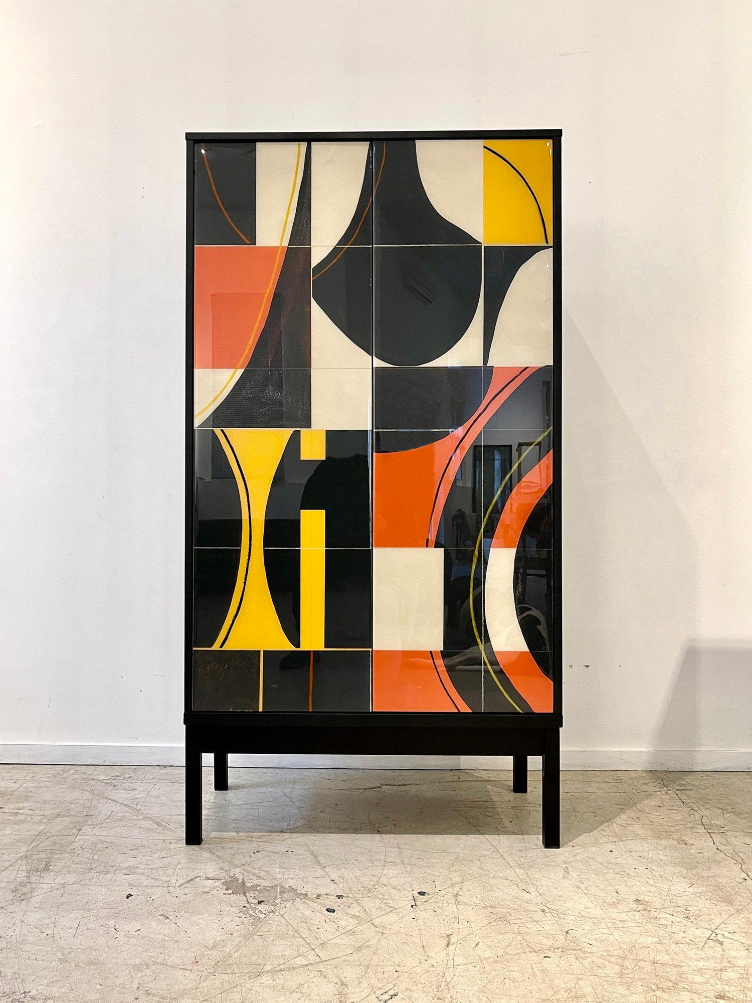 Bossa Armoire by Morgan Clayhall
Dimensions: D 45.72 x W 96.52 x H 182.88 cm
Materials: walnut, mix medium, resin, steel
Also available: Can be customized in size, finish and color.

The Bossa Armoire is painted by hand creating a one of kind