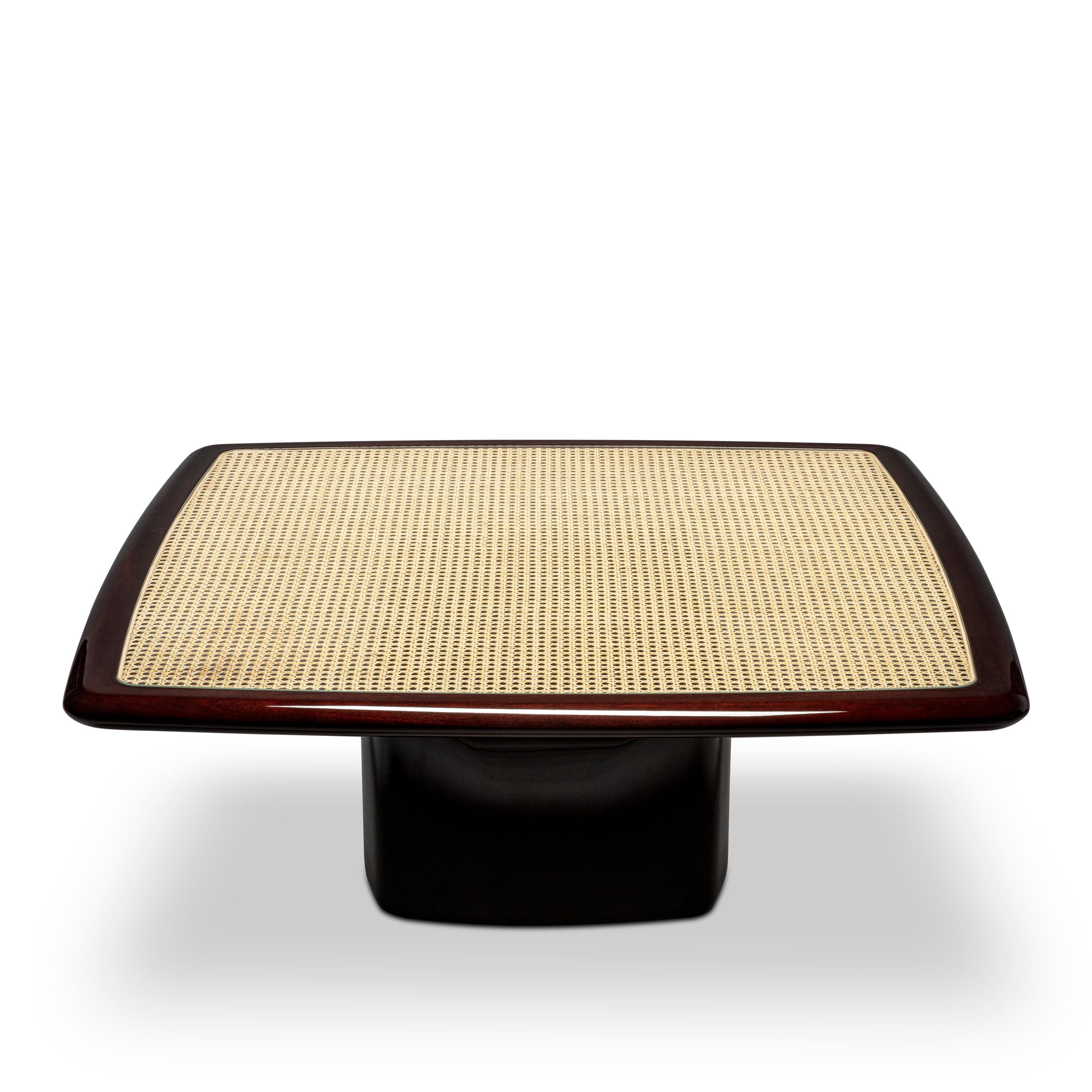 Bossa Square Coffee Table by DUISTT 
Dimensions: W 100 x D 100 x H 39 cm
Materials: High gloss Mahogany wood, Cane and Glass 
Assembly required

The Bossa square coffee table, crafted with great attention to detail, is inspired by the subtlety,