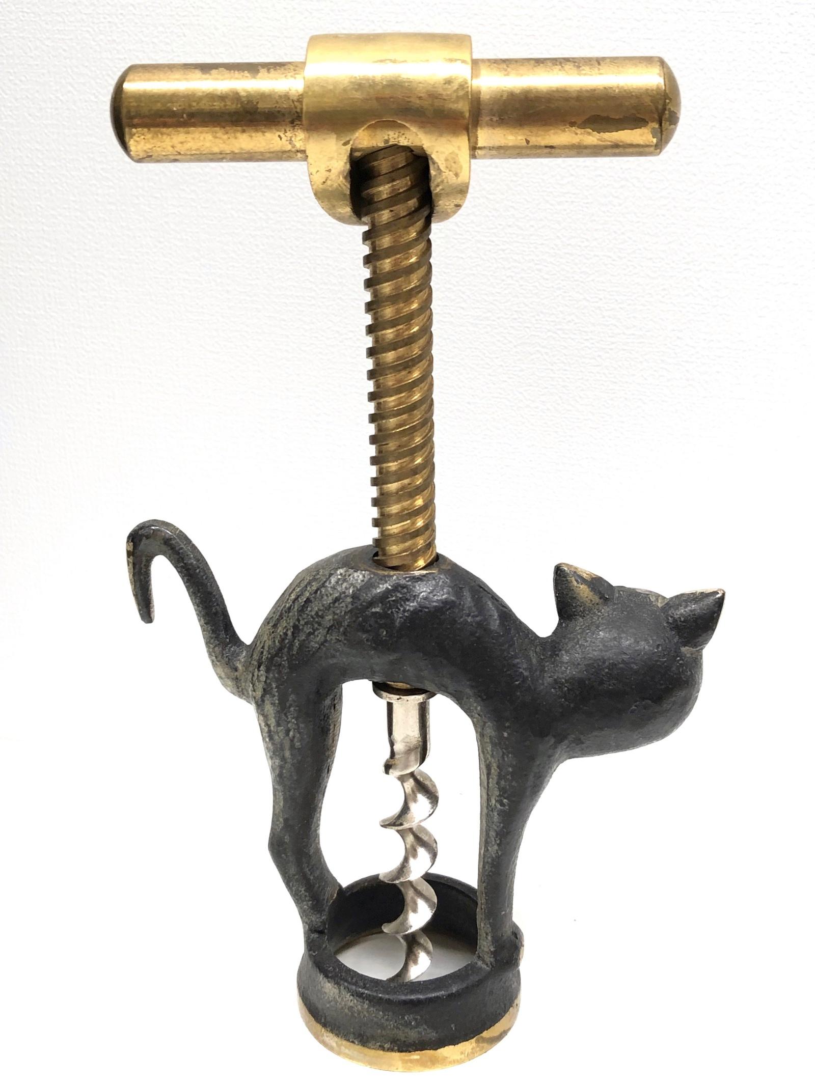 Classic early 1950s Austrian baller corkscrew in the form of a Halloween cat. The cat has glass eyes. Nice addition to your room or just for your collection of Austrian bronze items. Found at an estate sale in Vienna, Austria.