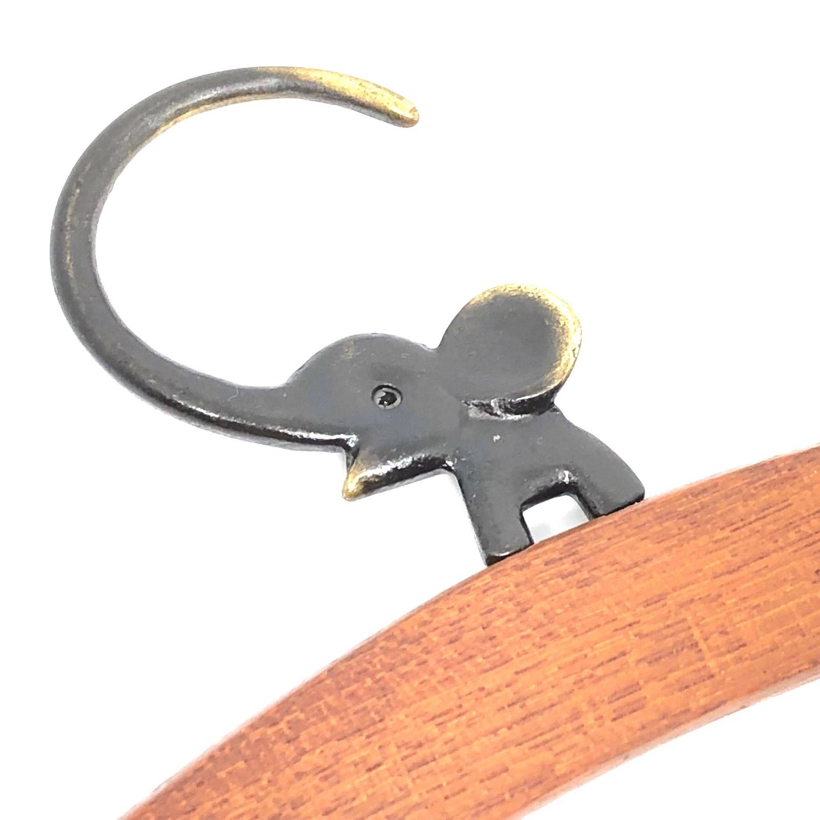 Classic early 1950s Austrian Walter Bosse coat hanger in the form of a elephant. Nice addition to your room or just for your collection of Austrian bronze items. Found at an estate sale in Vienna, Austria. Made of teak wood and bronze (metal).