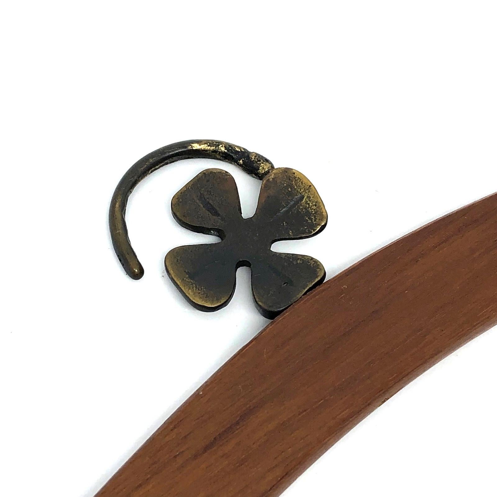 Classic early 1950s Austrian Walter Bosse coat hanger in the form of a Lucky Clover. Nice addition to your room or just for your collection of Austrian bronze items. Found at an estate sale in Vienna, Austria. Made of teak wood and bronze (metal).