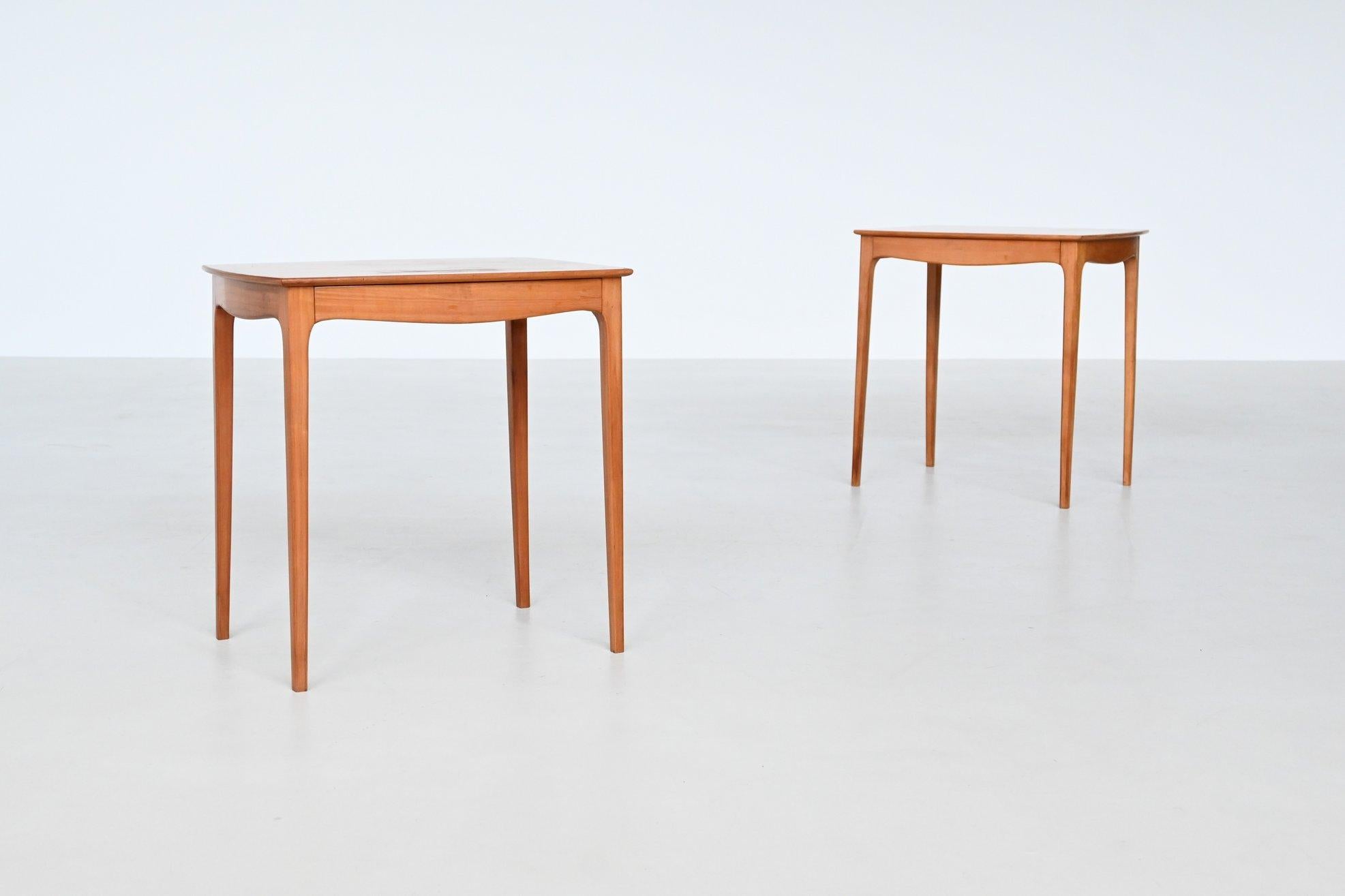 Beautiful pair of nightstands designed and manufactured by Bosteels Meubelen in Sint-Niklaas, Belgium 1960. These very nice elegant shaped side tables or nightstands are made of cherry wood. This remarkable set holds a strong expression and is
