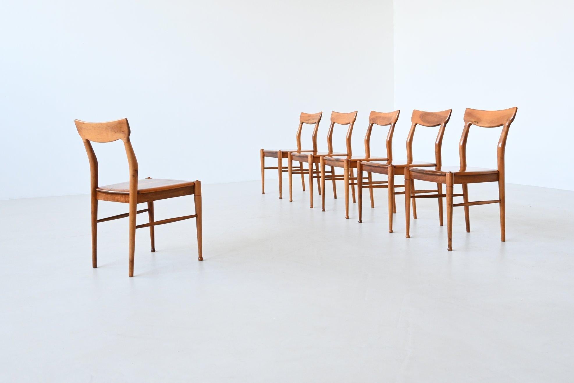 Fantastic and unique set of six dining chairs designed and manufactured by Bosteels Meubelen in Sint-Niklaas, Belgium 1960. These very nicely shaped chairs are made of beautifully grained solid walnut. They are sturdy and seat very comfortable. This