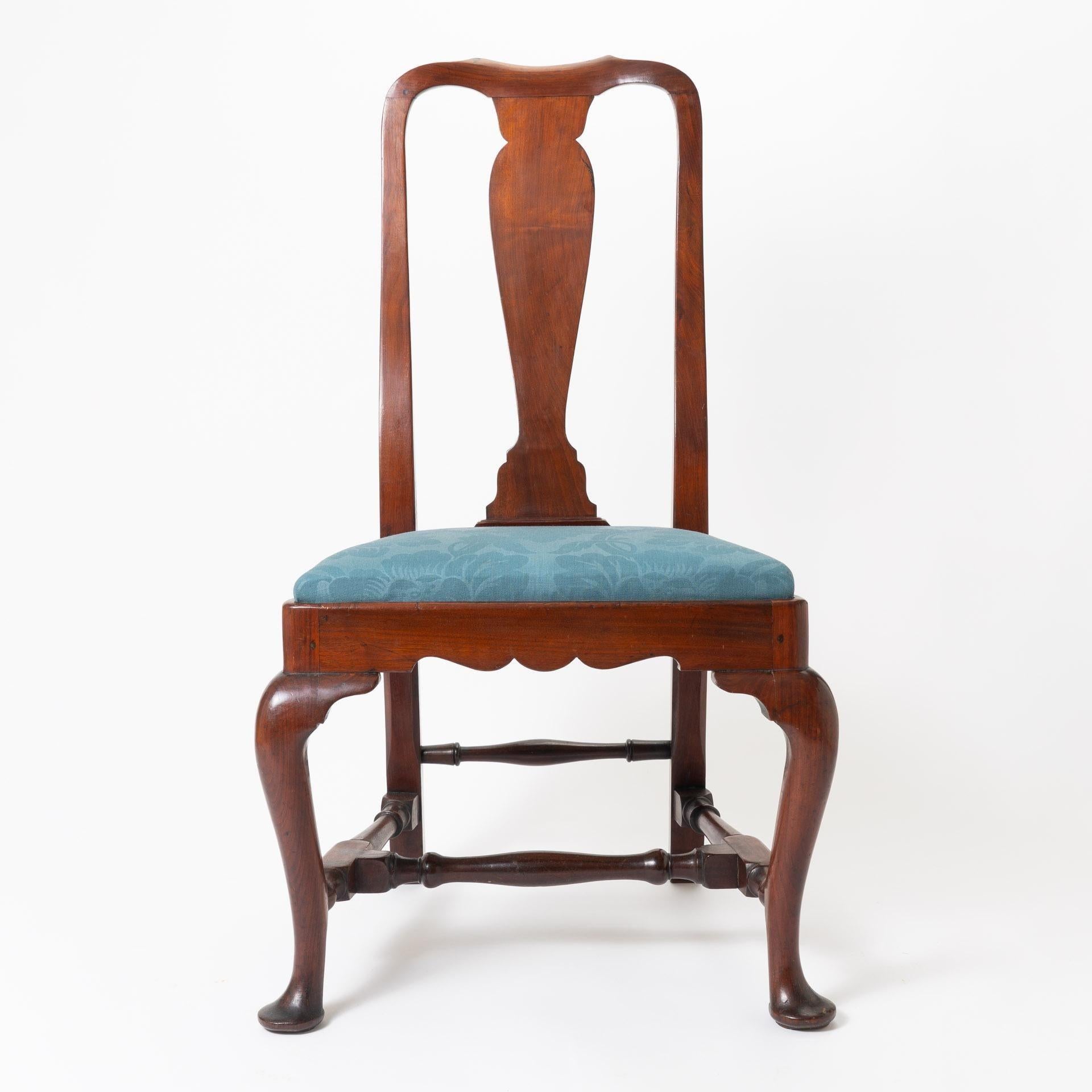 American Queen Anne old growth mahogany upholstered slip seat side chair. The square seat is fitted to a conforming scolloped profile frame on cabriole legs terminating in pad feet. The seat is upholstered with horse hair fill and covered in a blue