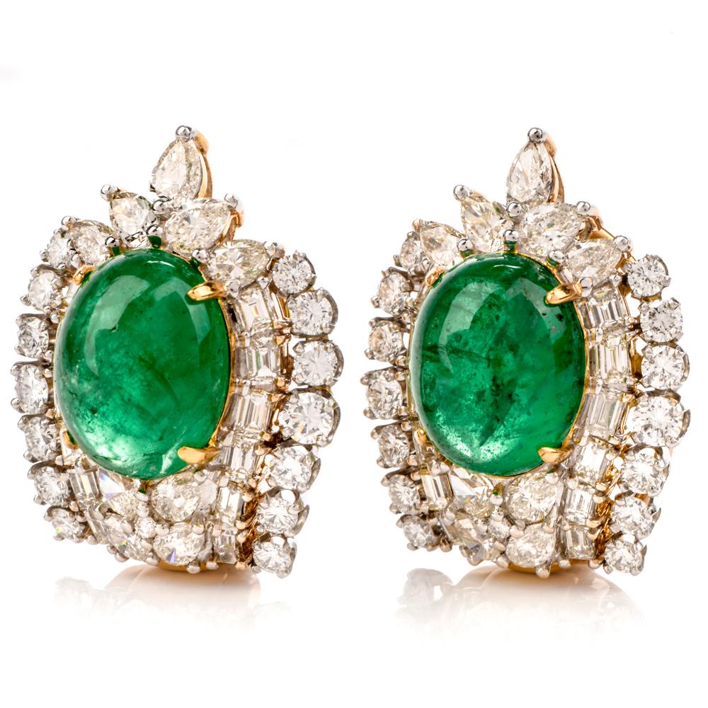 These stunning elegant emerald, diamond earrings are crafted in  combination of solid Platinum and 18-karat yellow gold, weighing 31 grams and measuring 30mm long x 24mm wide. Showcasing two prominent oval shaped, prong set emerald cabochons,