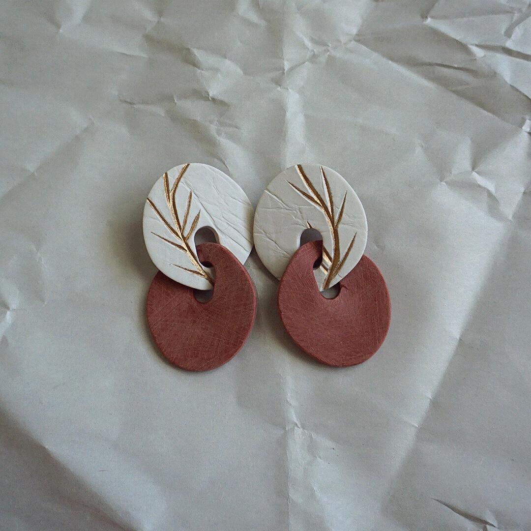 Botanical Hand Carved Link Earrings by Shape + Form

Ultra lightweight statement link earrings made of polymer clay with powdered copper inlay. Uniquely textured and carved by hand. Each component goes through a laborious process that begins with