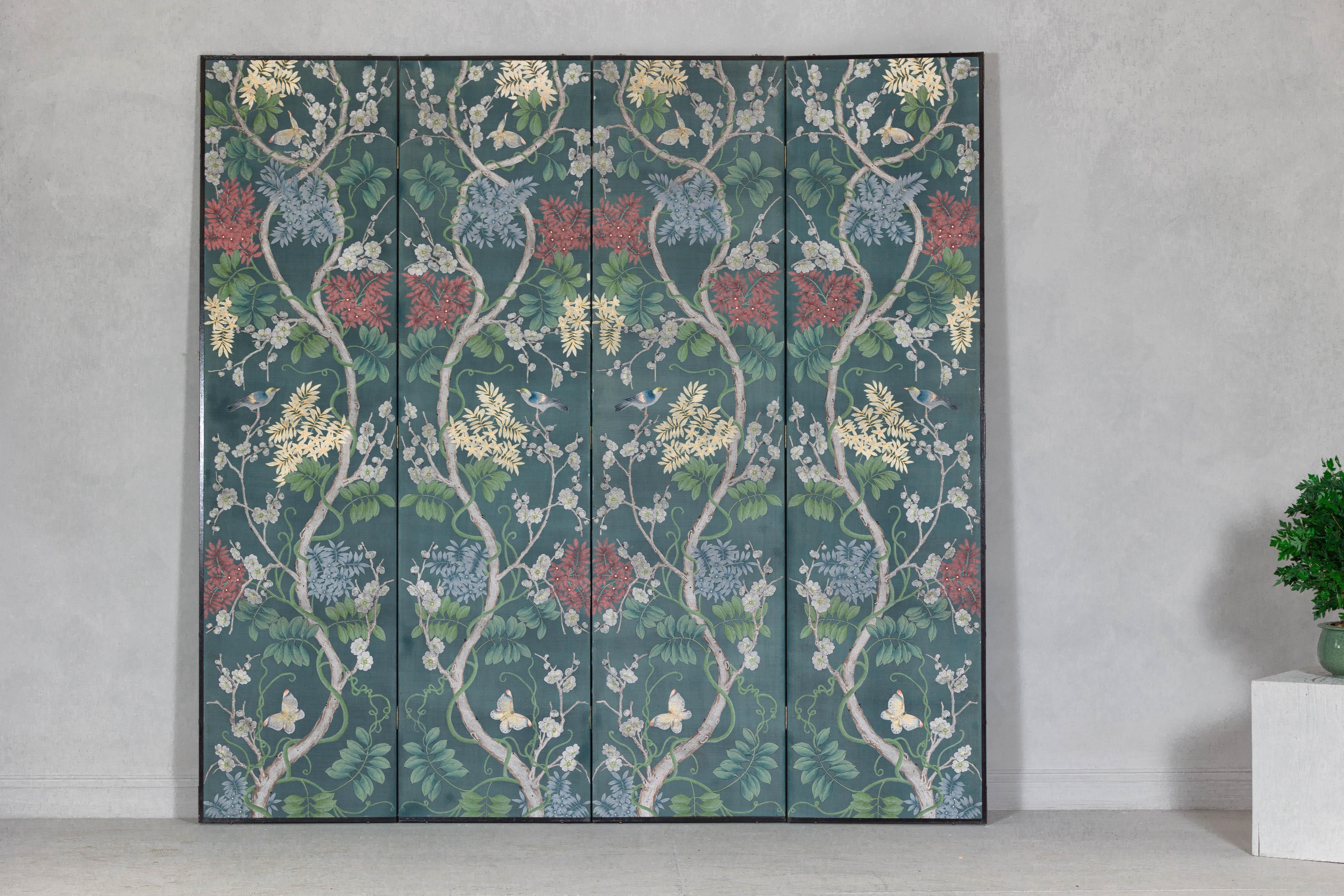 A vintage hand-painted room divider featuring vibrant flowers and delicate vines. This vintage hand-painted room divider showcases a mesmerizing botanical scene, featuring an array of colorful flowers, lush green leaves, and delicate winding vines