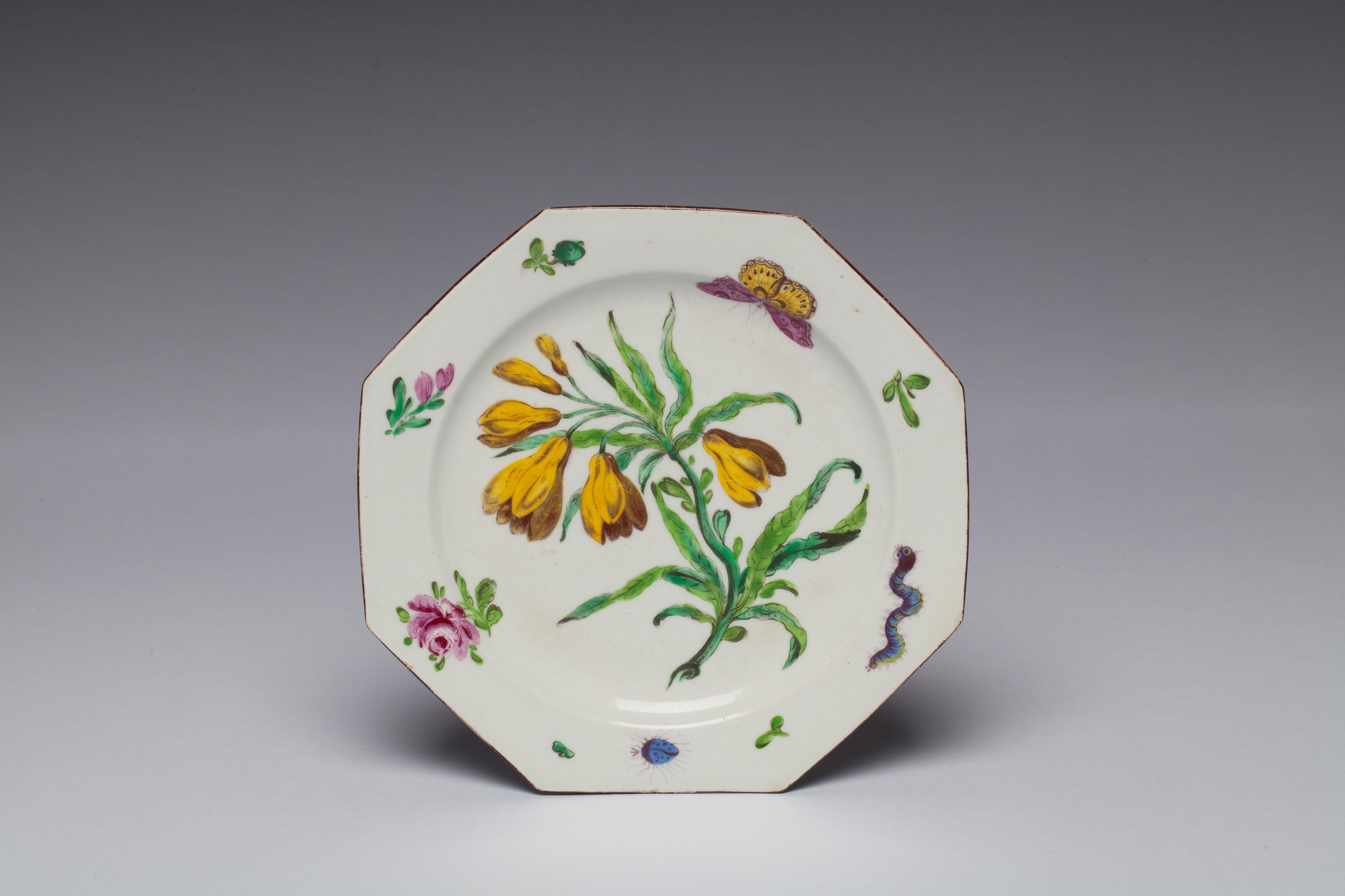 A fine octagonal plate painted in the botanical style; possibly the yellow gloriosa climbing lily.

Provenance: Taylor Collection; Robyn Robb 2003.
Filled edge chips.
 