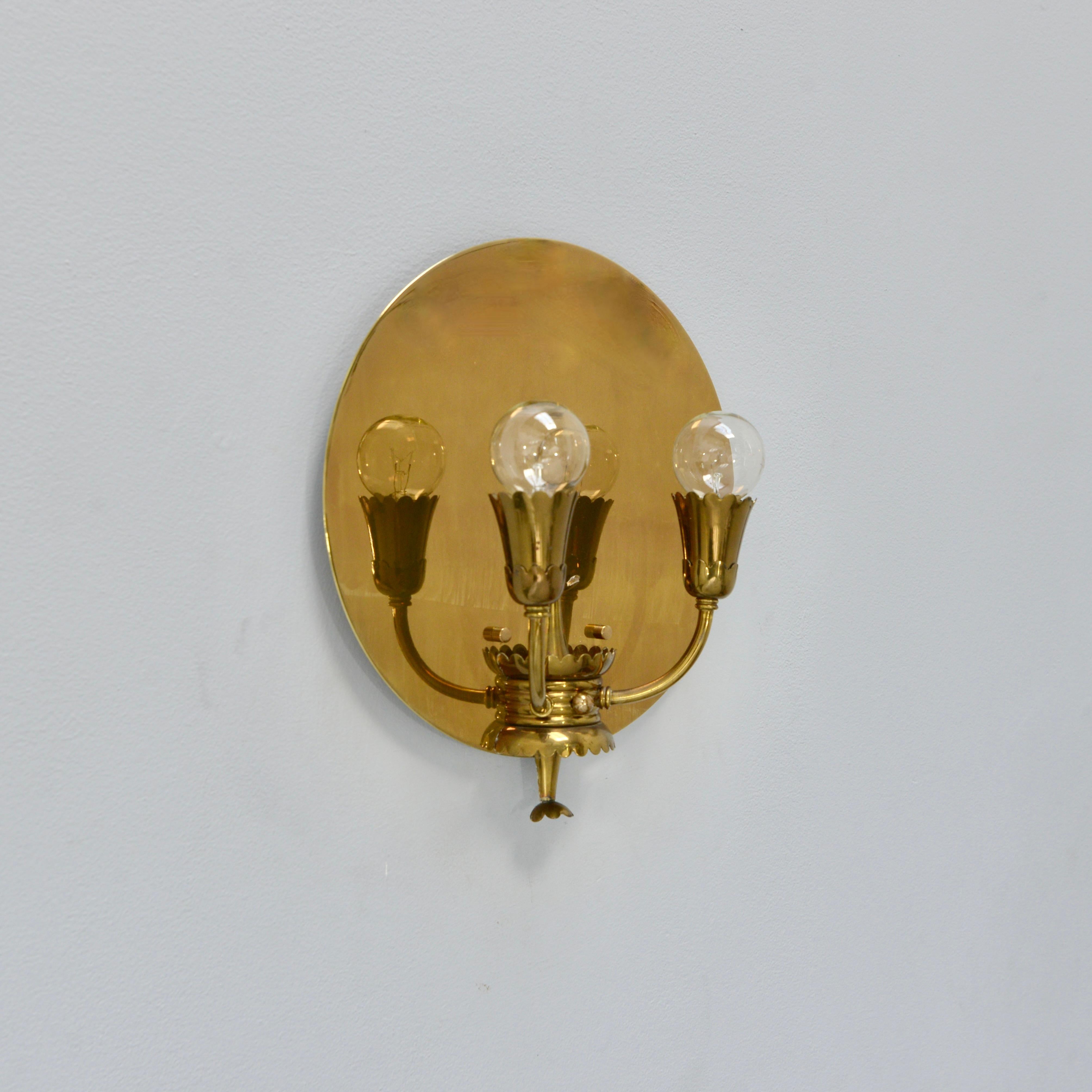 Unique pair of late 1940s Italian Botanical Shield Sconces II. Partially restored with 2 E12 candelabra based sockets per sconce wired for use in the USA. These sconces are in all brass. They can also be wired for use anywhere in the world.