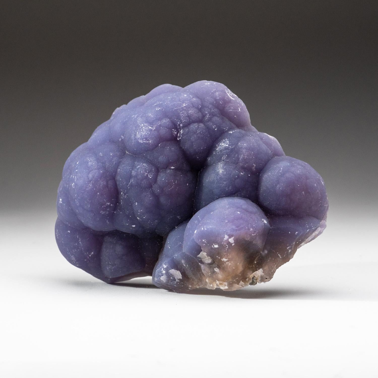 From Minggang Mine, Xinyang Prefecture, Henan, China Translucent purple fluorite in botryoidal formation with sculptural hemispherical aggregates covering both sides of its matrix. The organic formations of this mineral, combined with its unique