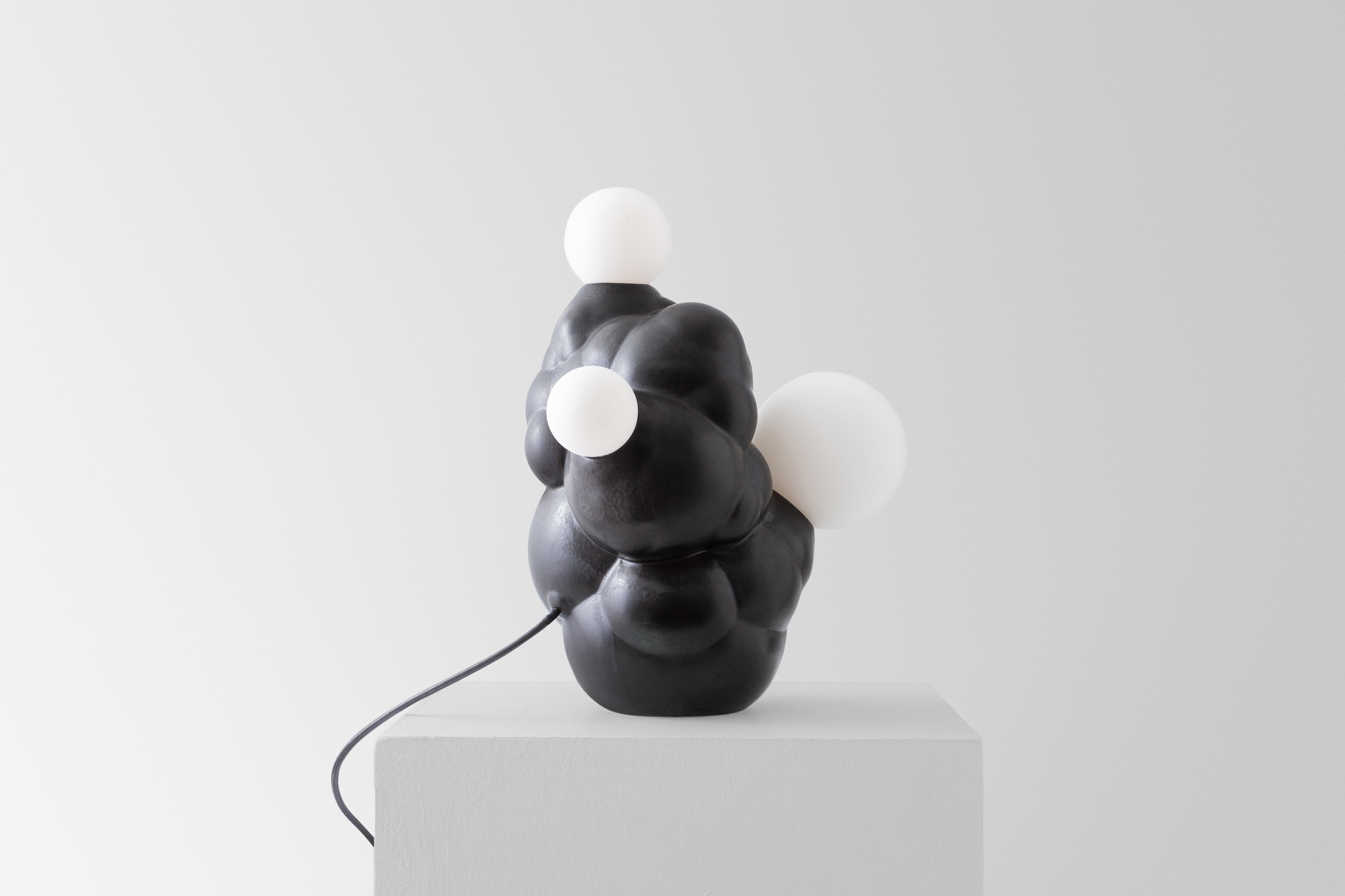 Botryoidal Table Lamp by Forma Rosa Studio
Dimensions: D 35.5 x W 30.5 x H 50.8 cm.
Materials: Ceramic, brass.

Available in Charcoal and Bronze colors.

Our Bubbly Lamp is digitally grown to imitate the fractal growth of botryoidal crystals in