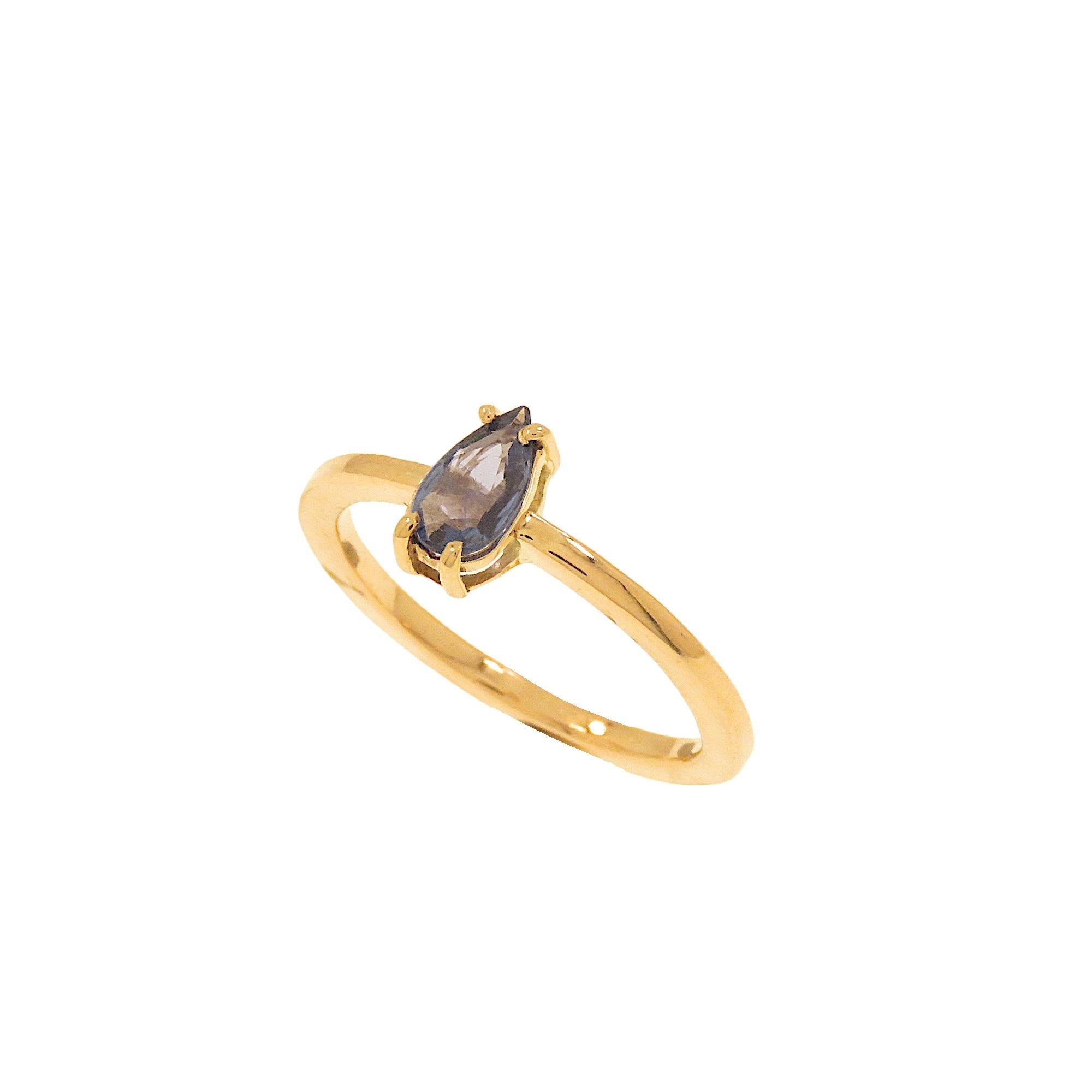 Elegant ring with drop-cut blue sapphire mounted on 9k rose gold jaw bezel. The ring is also ideal for an engagement gift. The jewelry was made entirely by hand in our workshop in Milan. The teardrop-cut blue sapphire weighs 0.45 carat. Ring size: