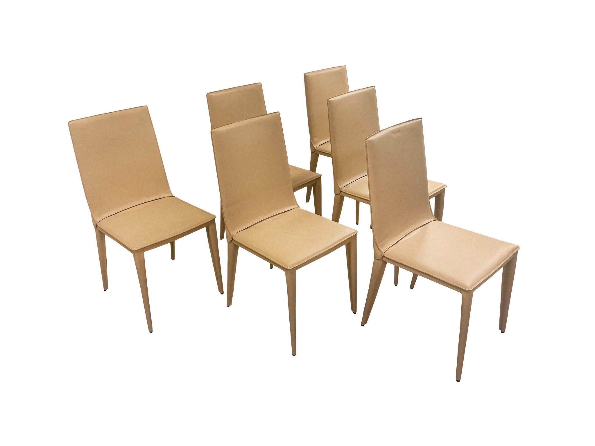 Designed by Renzo Fauciglietti & Graziella Bianchi for Frag, these 6 Italian Bottega dining chairs were made in the early 2000s. They are comprised of a steel frame wrapped in a cream-tan leather and with light padding.

Dimensions:
17.75 in.