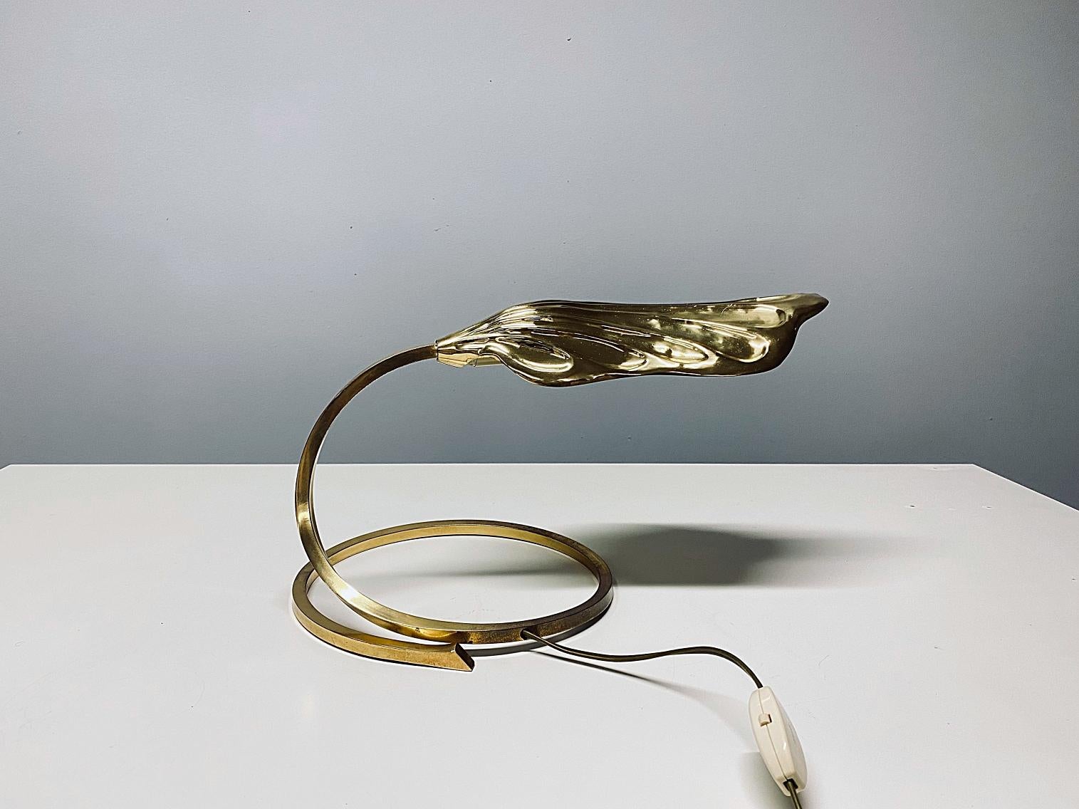 Beautiful table lamp designed by Tommaso Barbi for Bottega Gadda manufactured in 1970s, Italy. The lamp is made of polished brass. The lamp provides a smooth and wonderful light. The lamp is in a very good original condition, fully working and