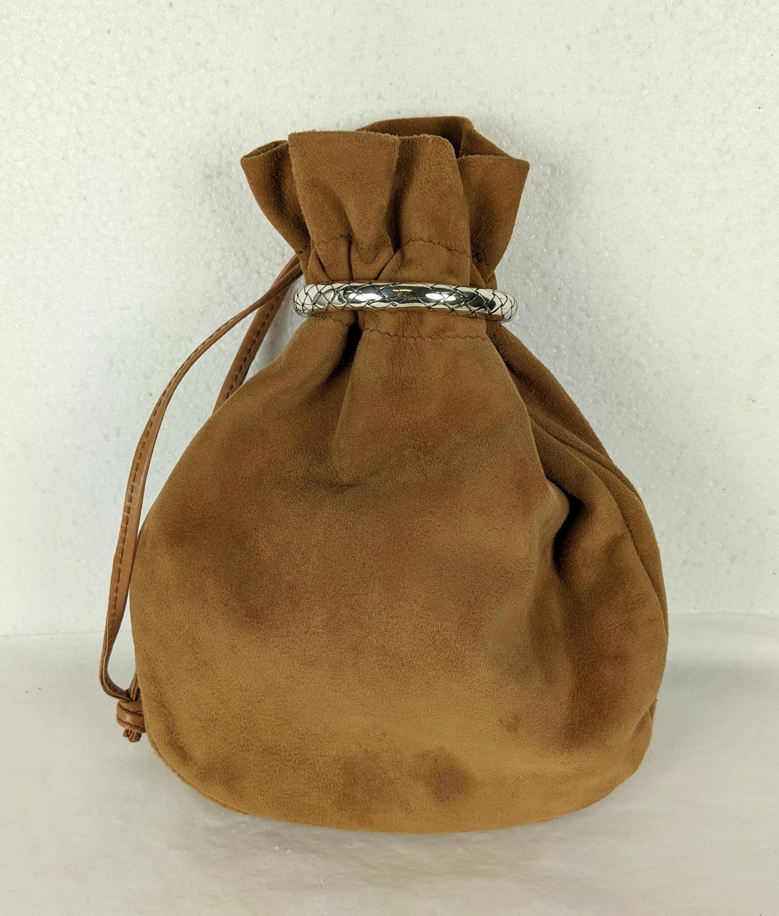Bottega Suede Pouch Bag with sterling intrecciato woven ring closure. Ring flips up and bag opens with drawstring. Suede lined in a deeper toned leather. 
1980's Italy. 9