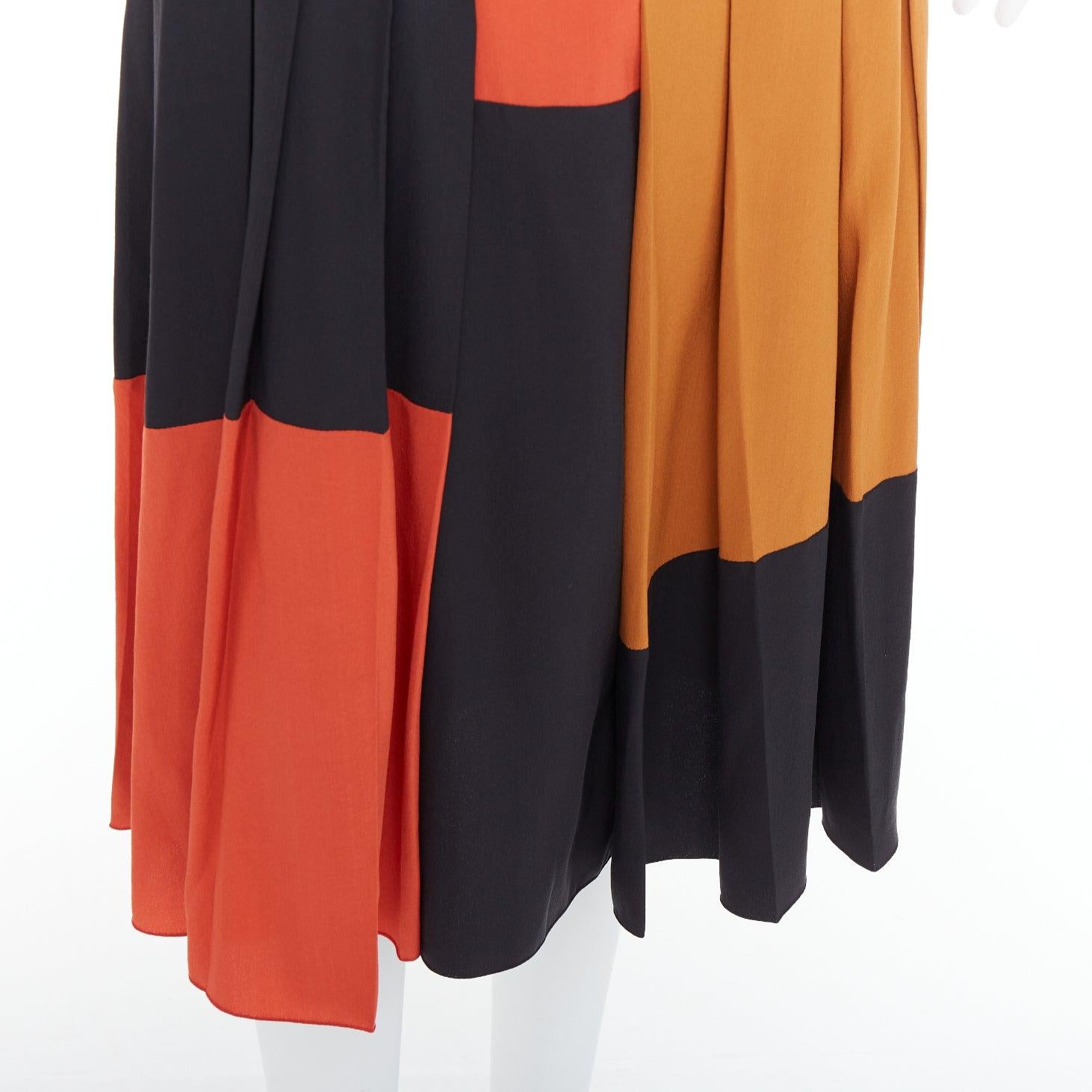 BOTTEGA VENETA 100% silk  black orange brown colorblock pleated skirt IT36 XXS
Reference: LNKO/A02499
Brand: Bottega Veneta
Designer: Tomas Maier
Material: Silk
Color: Black, Orange
Pattern: Solid
Closure: Zip
Extra Details: Side zip.
Made in: