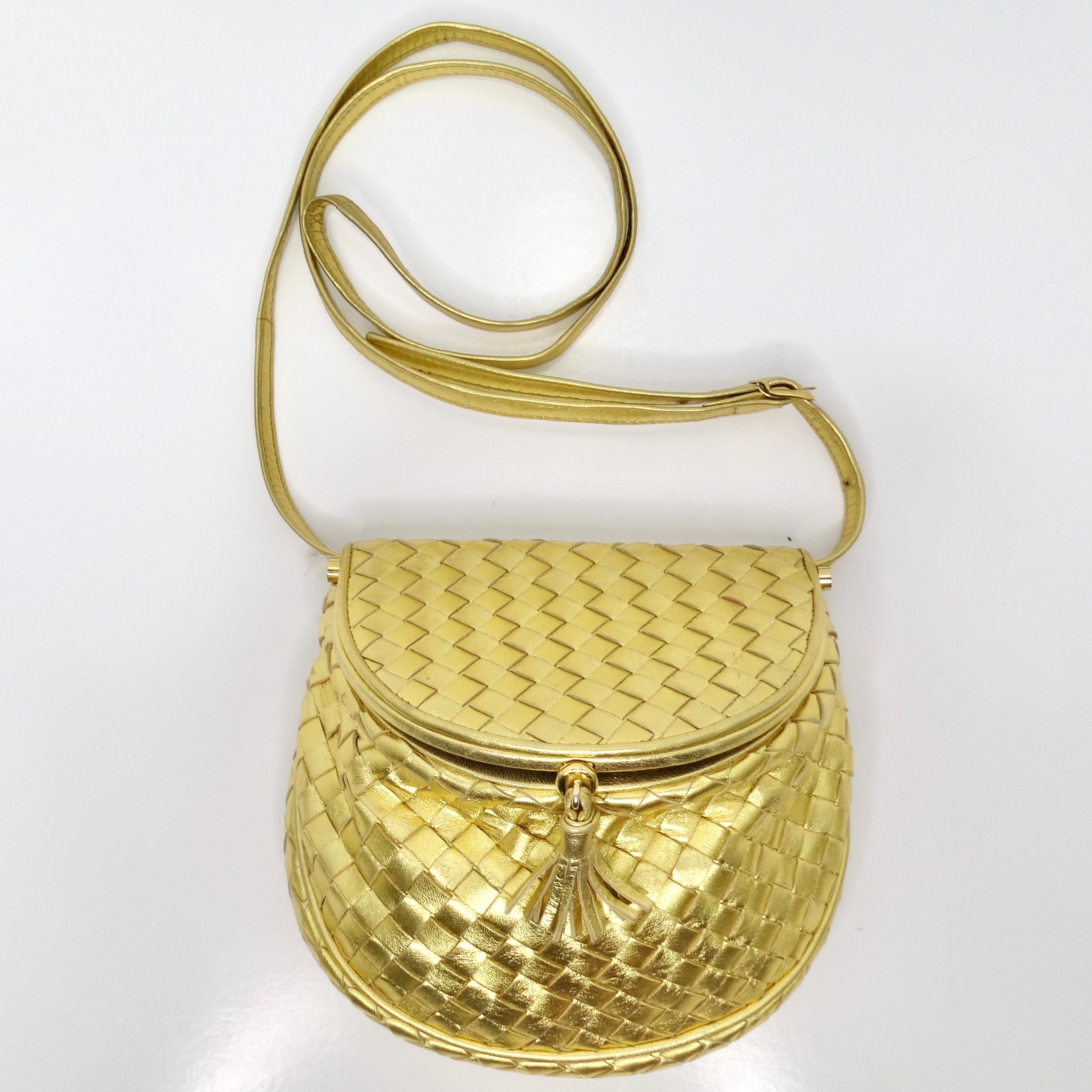 Introducing the Bottega Veneta 1980s Intrecciato Flap Crossbody Bag, a timeless piece that epitomizes the sophistication and elegance of the era. Crafted from luxurious metallic gold signature Bottega woven leather, this mini flap bag is a statement