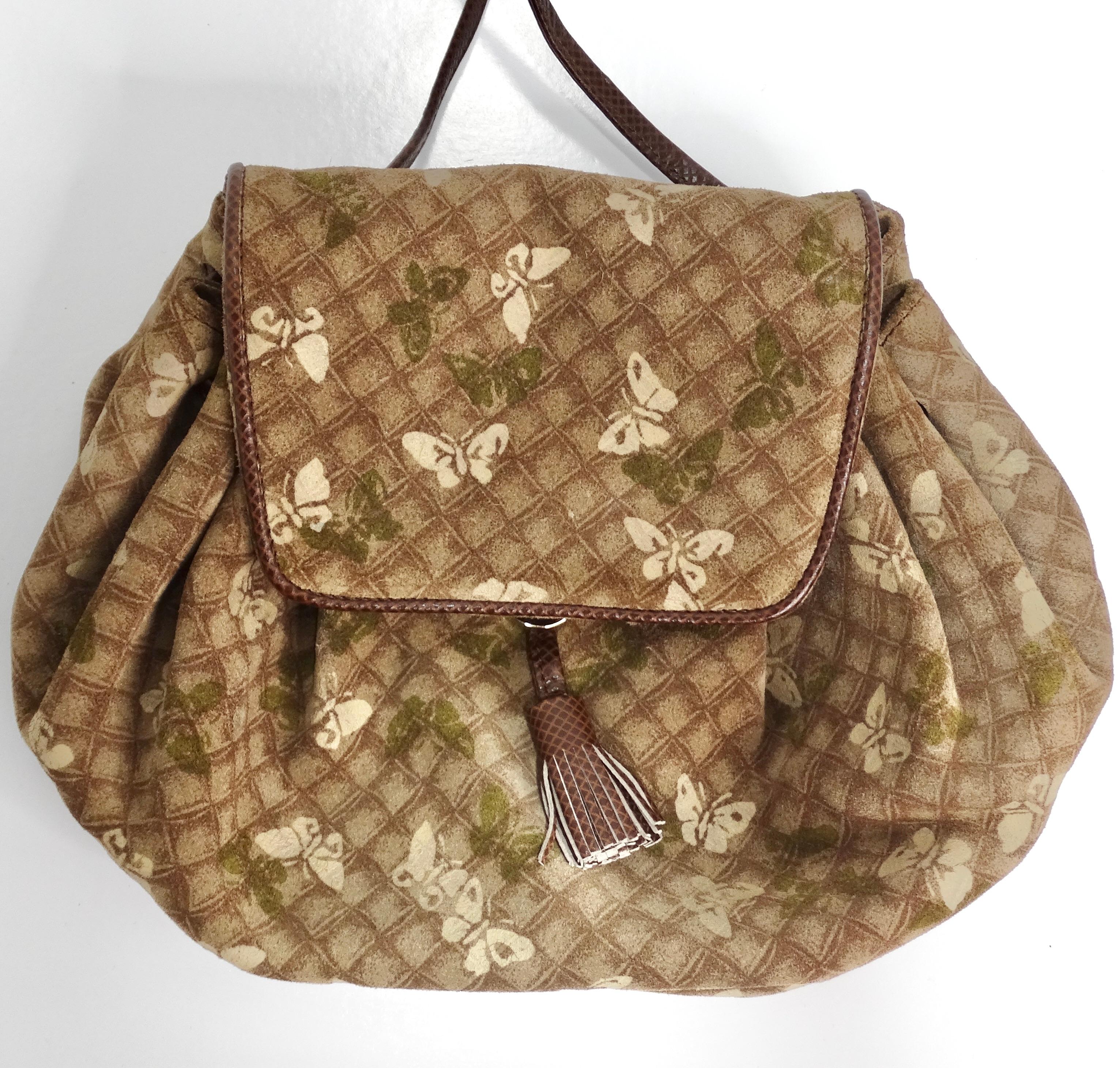 Introducing the stunning Bottega Veneta 1980s Suede Drawstring Handbag, a unique and elegant accessory that combines luxurious materials with timeless design. Crafted from high-quality beige printed suede, this handbag features a captivating print