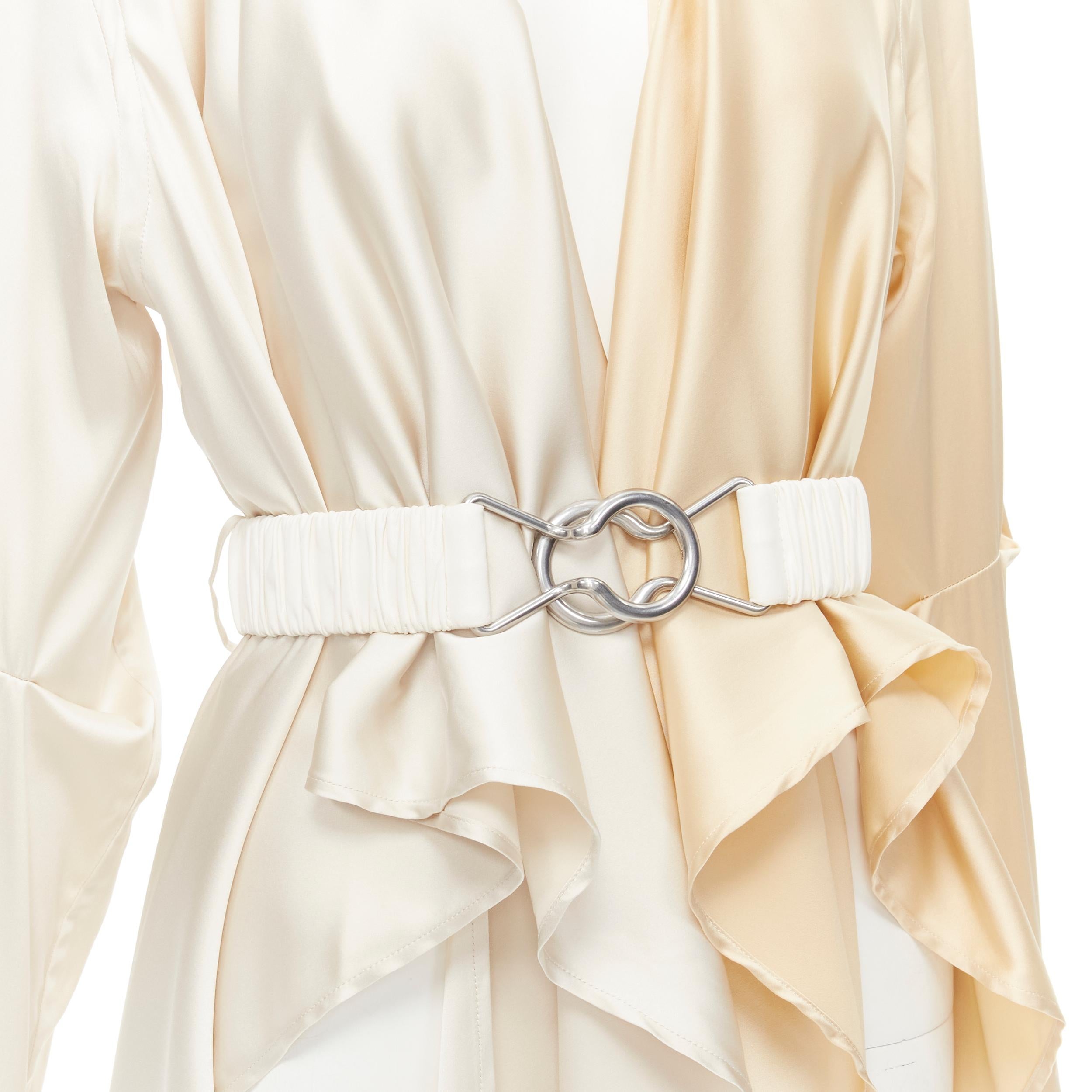 BOTTEGA VENETA 2019 Daniel Lee 100% silk cream leather belted draped robe IT40 S 
Reference: KEDG/A00049 
Brand: Bottega Veneta 
Designer: Daniel Lee 
Collection: Fall Winter 2019 
Material: Silk 
Color: Cream 
Pattern: Solid 
Extra Detail: Can be