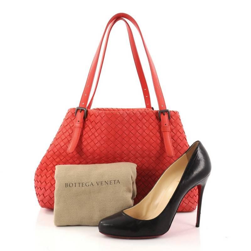 This authentic Bottega Veneta A-Shape Tote Intrecciato Nappa Medium is a statement piece you can surely take from day to night. Crafted in red nappa leather woven in Bottega Veneta's signature intrecciato method, this stylish tote features