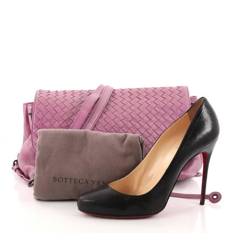 This authentic Bottega Veneta Accordion Flap Messenger Leather with Intrecciato Medium is perfect for your casual looks. Crafted in metallic lavender nappa leather, this industrial-inspired bag features a detachable strap, Bottega Veneta's woven