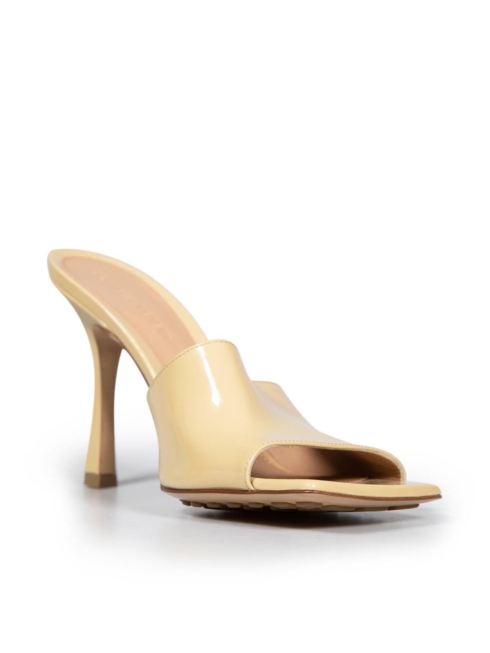 CONDITION is Never worn. No visible wear to shoes is evident on this new Bottega Veneta designer resale item. These shoes come with original dust bag.
 
 Details
 Model: Stretch
 Beige
 Patent leather
 Mules
 Open toe
 High heeled
 
 
 Made in