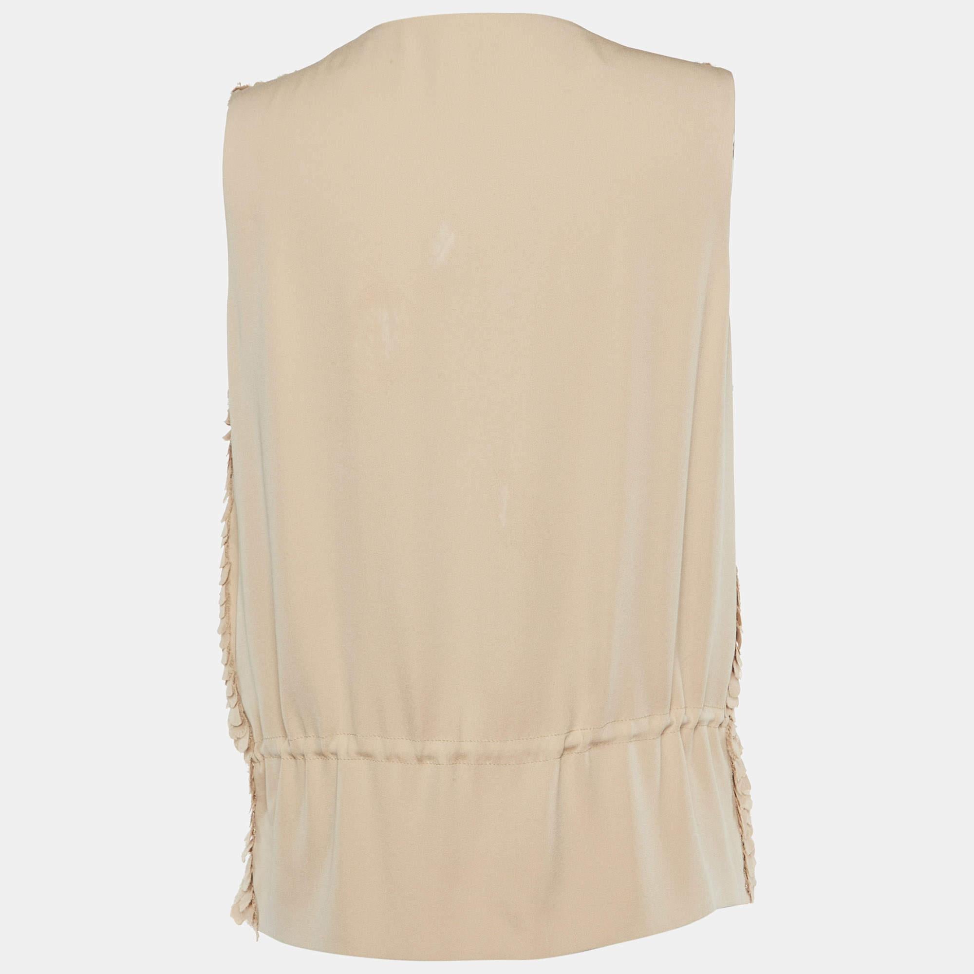 Questo top griffato offre stile e comfort. Realizzata con i migliori tessuti, la creazione è stata curata nei minimi dettagli. Abbinalo a un paio di jeans e a delle scarpe basse.