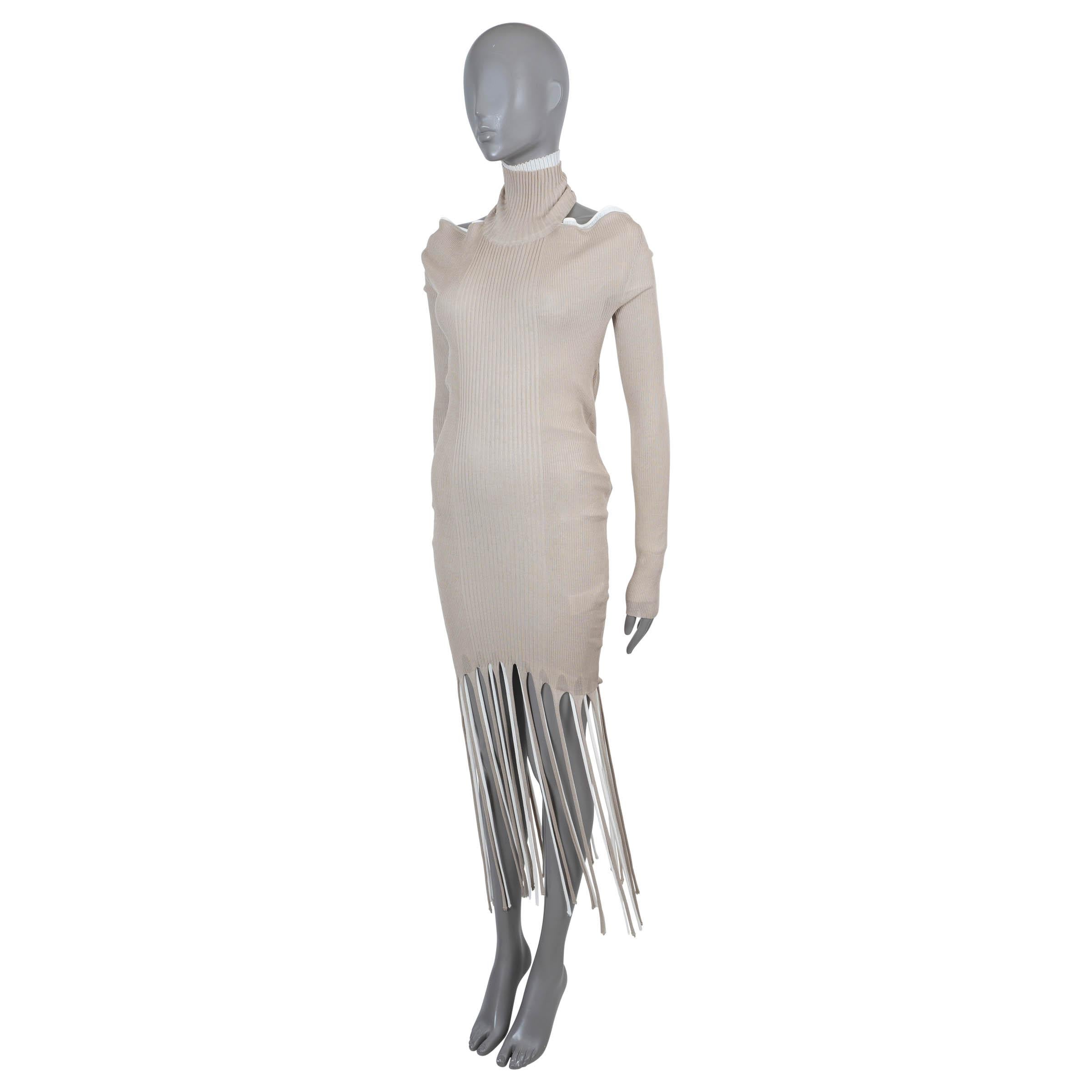 100% authentic Bottega Veneta midi knit dress in beige and white layer of rib-knit cotton (57%) and silk (43%). Features a bodycon silhouette with turtlenck, open back, long sleeves and shredded fringing along the bottom hem. Unlined. Has been worn