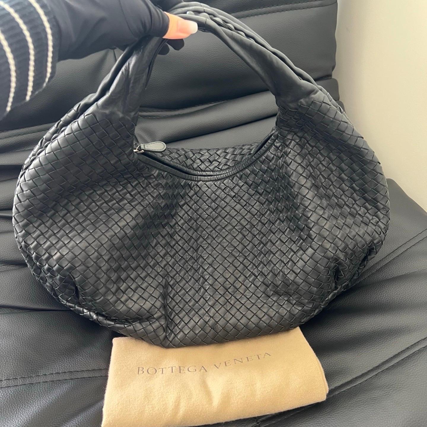This Bottega Veneta Belly Hobo Bag is an exceptional piece of luxury, crafted from iconic lambskin leather with the instantly recognizable Intrecciato weave. This bag is roomy enough for all your essentials, it's the perfect accessory for stylish