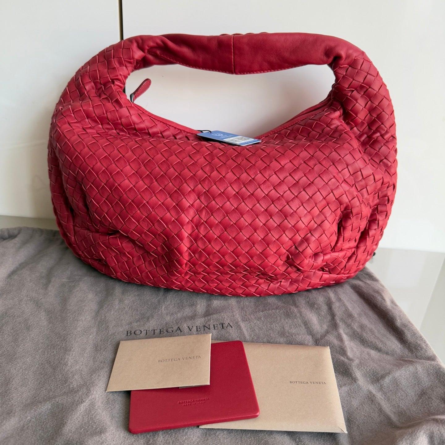 Bottega Veneta Belly Hobo Intrecciato Red Medium 40cm
 These are professional photos of the actual bag .
  
 This Bottega Veneta Belly Hobo Bag is an exceptional piece of luxury, crafted from iconic lambskin leather with the instantly recognizable