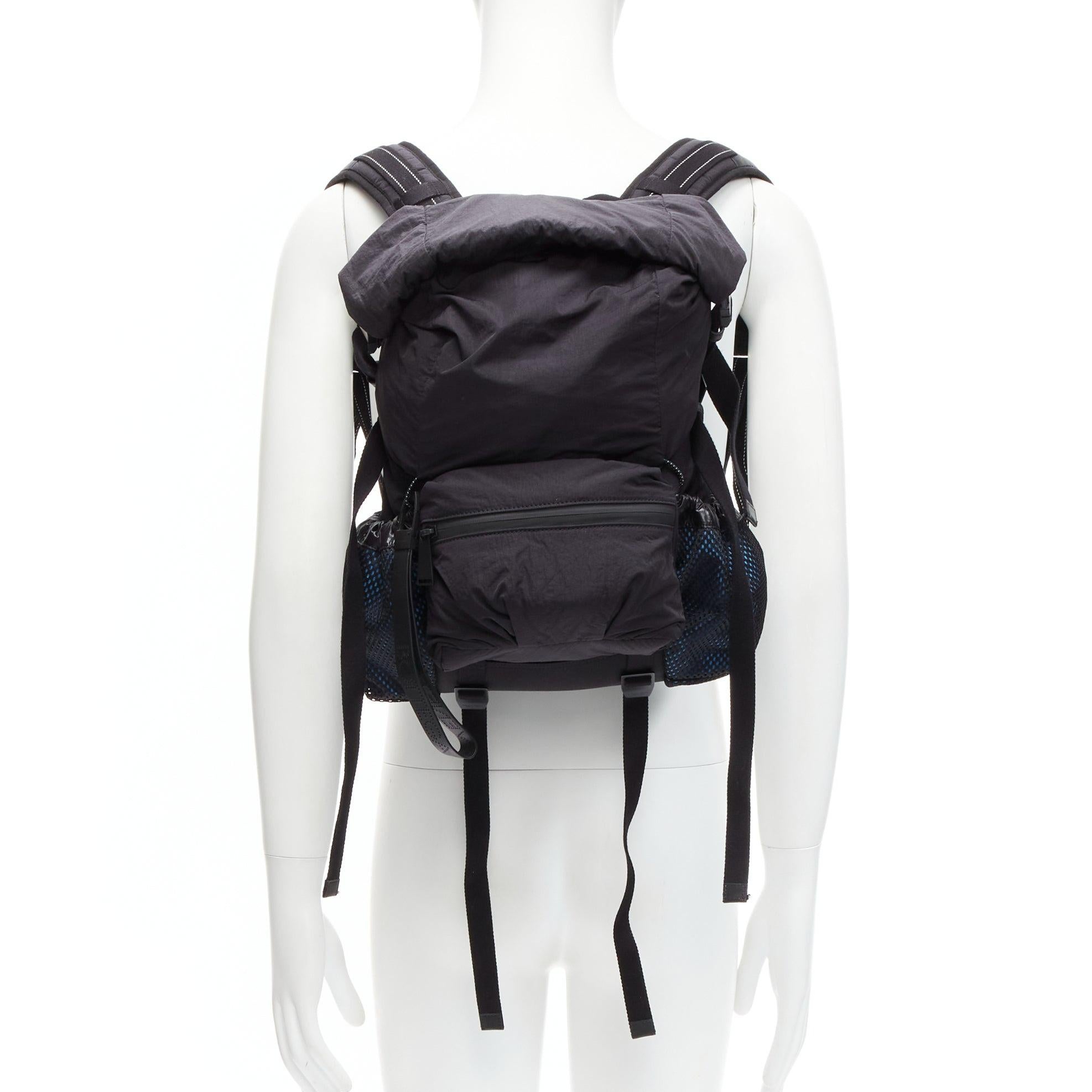 BOTTEGA VENETA black blue technical nylon small fold top backpack bag
Reference: CNLE/A00228
Brand: Bottega Veneta
Designer: Daniel Lee
Material: Nylon, Leather, Mesh
Color: Black, Blue
Pattern: Solid
Closure: Buckle
Lining: Blue Fabric
Extra