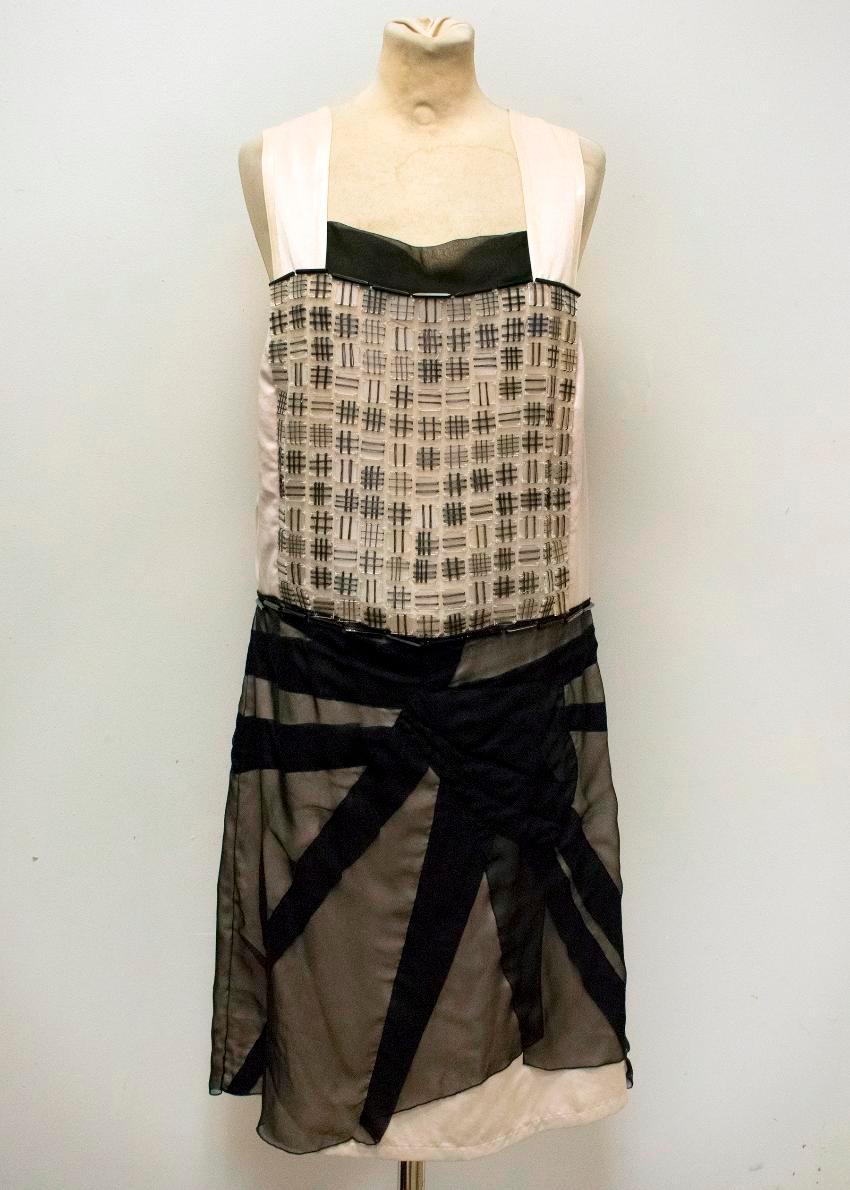 Bottega Veneta black and champagne sleeveless dress. Featuring clear square panels on the bust with black thread check panels. Featuring a square neck with a black sheer silk panel and a black skirt. Concealed side zip.

Brand new with
